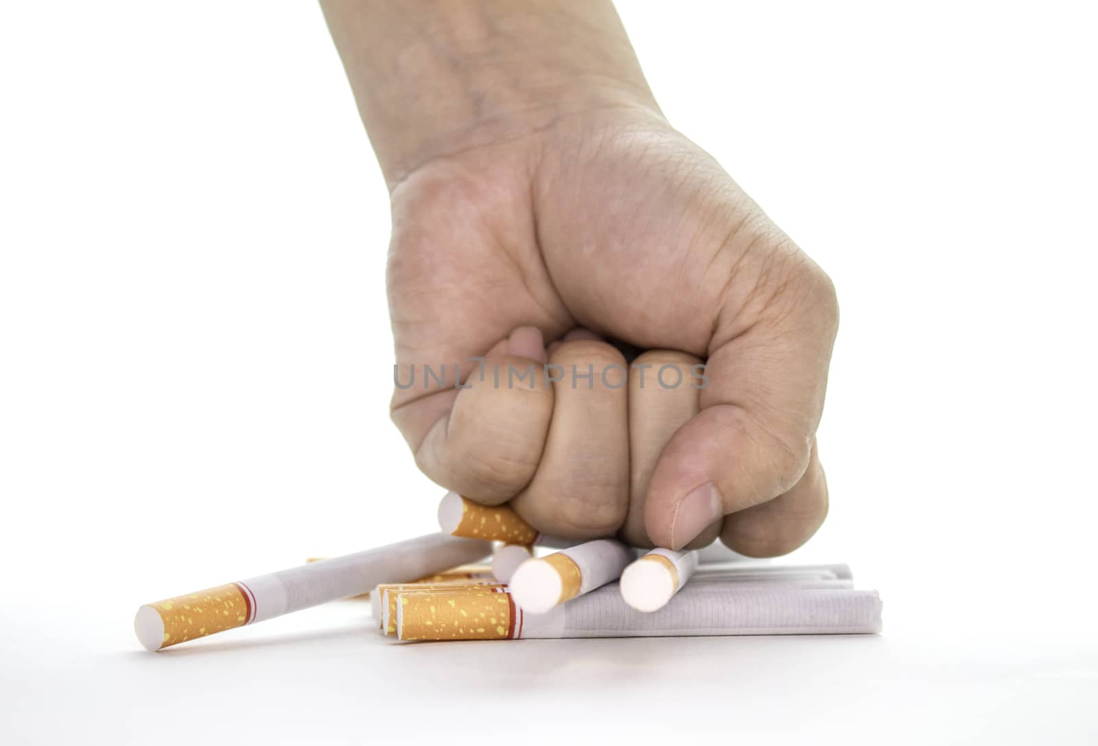World No Tobacco Day; fist breaking cigarette - stop smoking concept on white background and space for text.