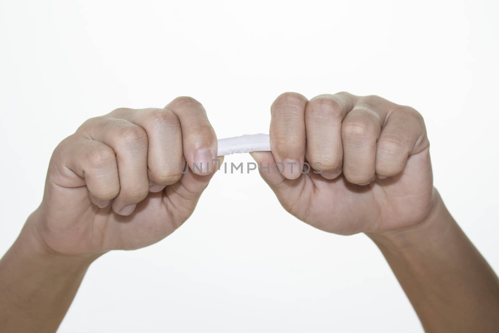 World No Tobacco Day; Woman hand destroying cigarettes isolated on white background and space for text.