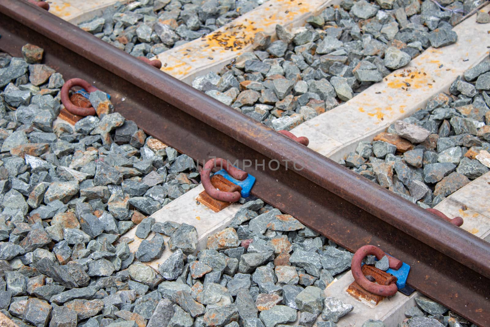 Close-up of Railroad tracks at Lamphun station, Thailand. by TEERASAK