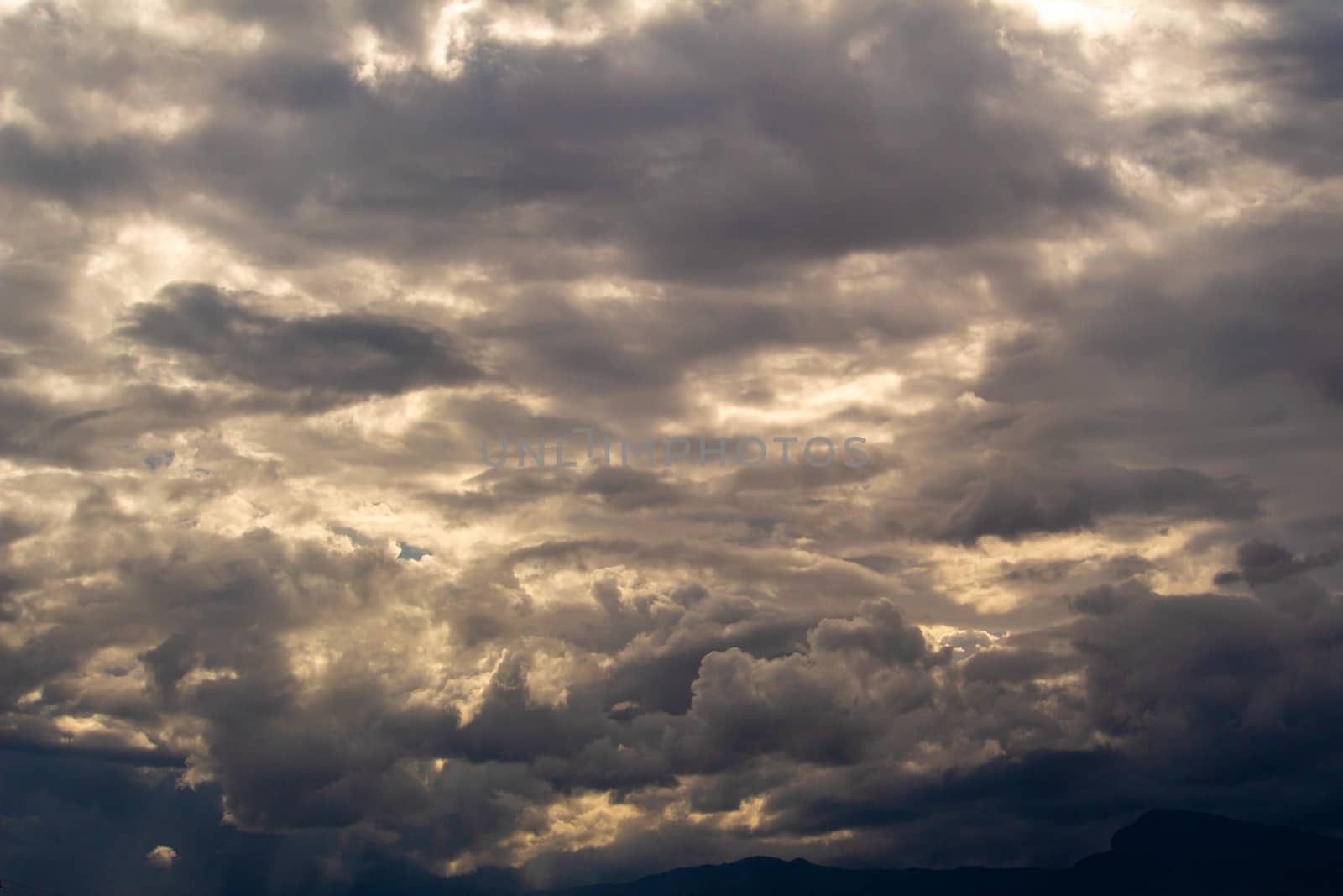 The Dark gray dramatic sky with large clouds in rainy seasons.