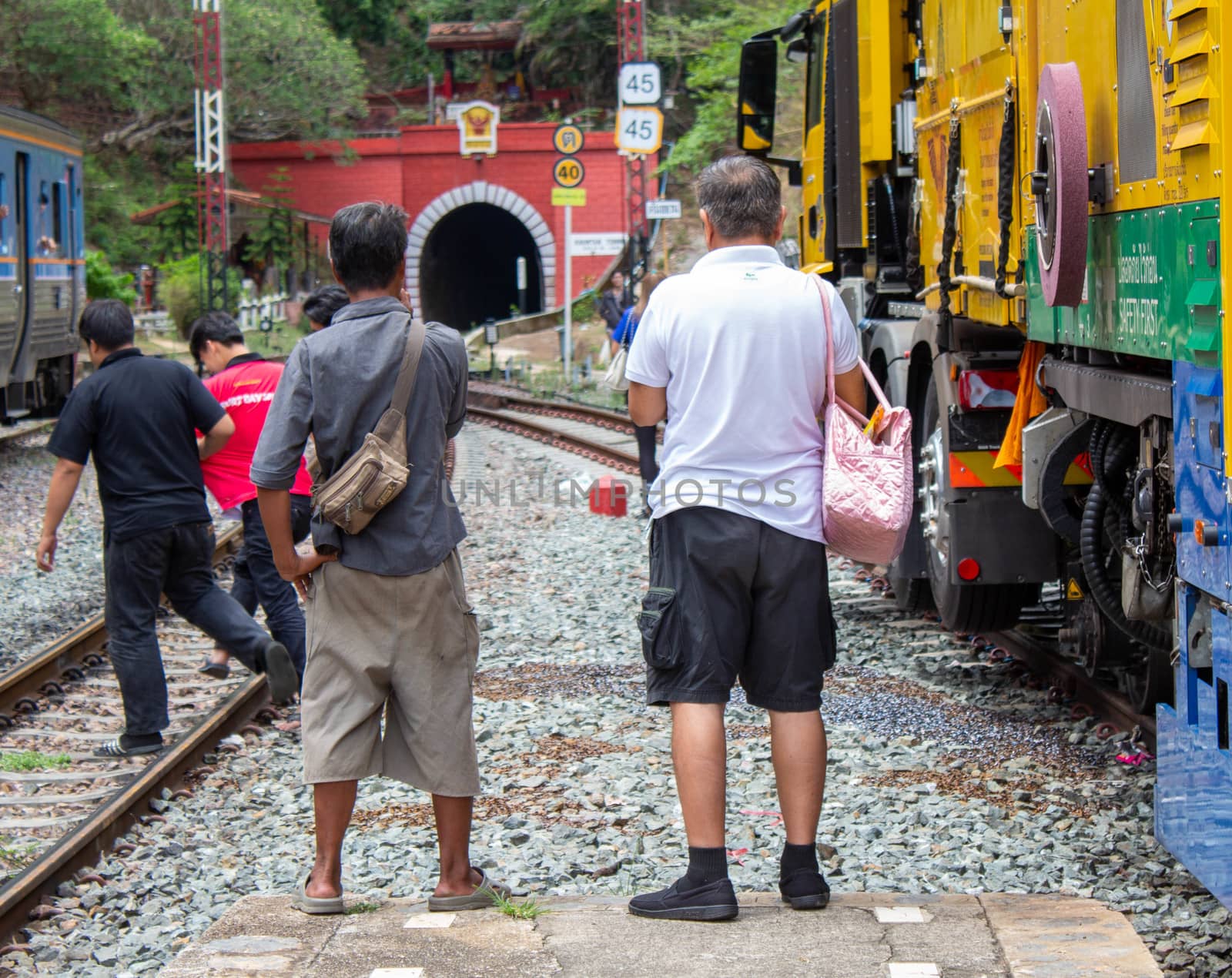 People waiting for Vintage diesel engine train at Khun Tan railway station, Lamphun Thailand. by TEERASAK