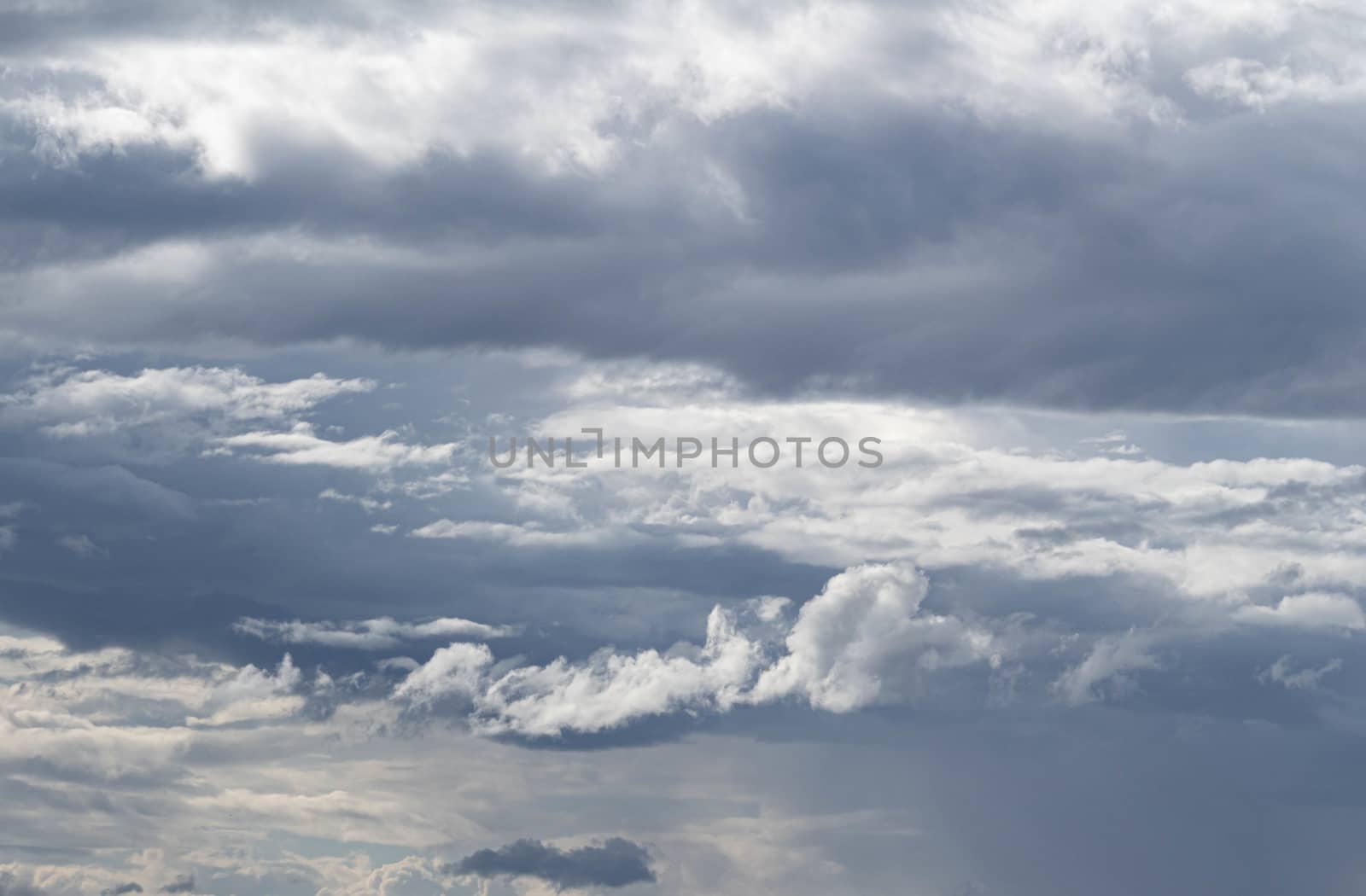 The Dark gray dramatic sky with large clouds in rainy seasons. by TEERASAK