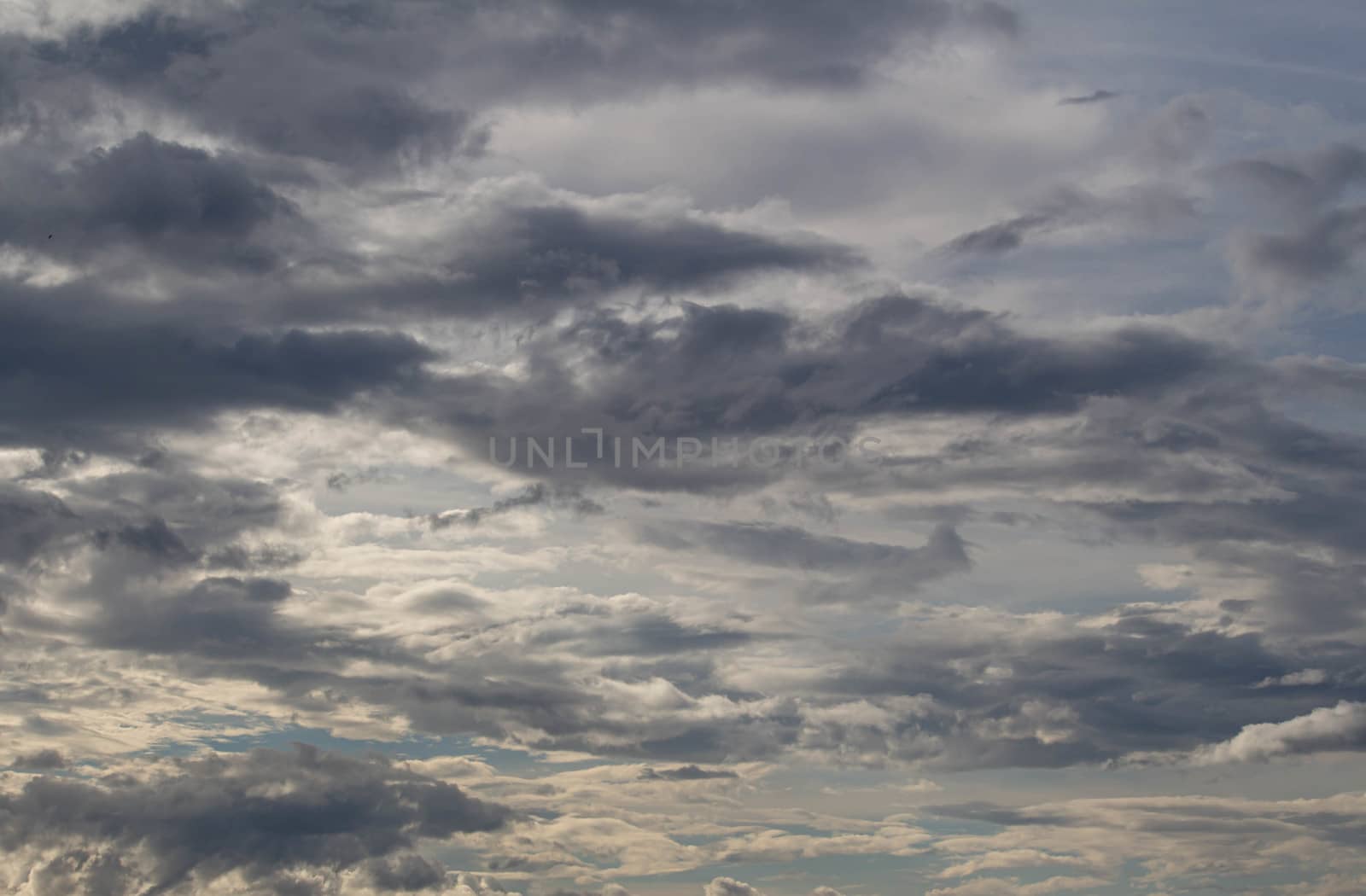 The Dark gray dramatic sky with large clouds in rainy seasons. by TEERASAK