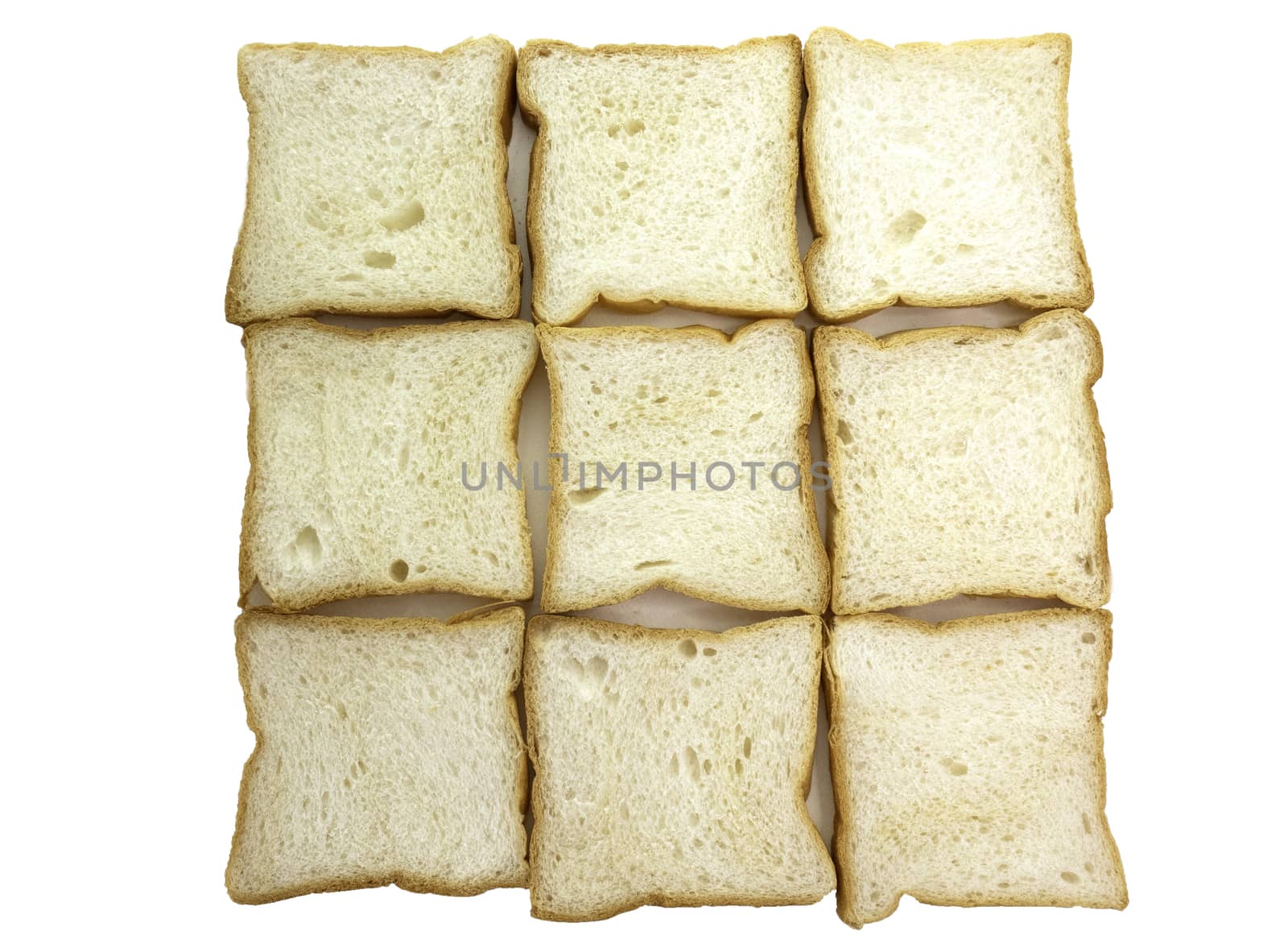 Heap of Stacked Sliced Bread on White Background.