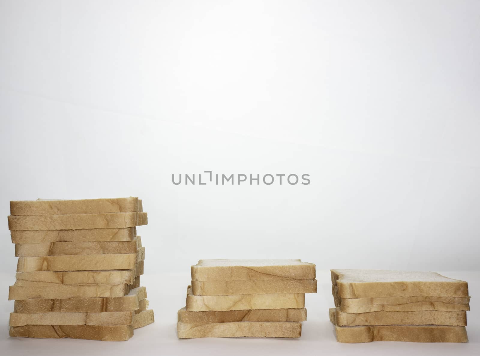 Loaf of sliced bread isolated on a white background.