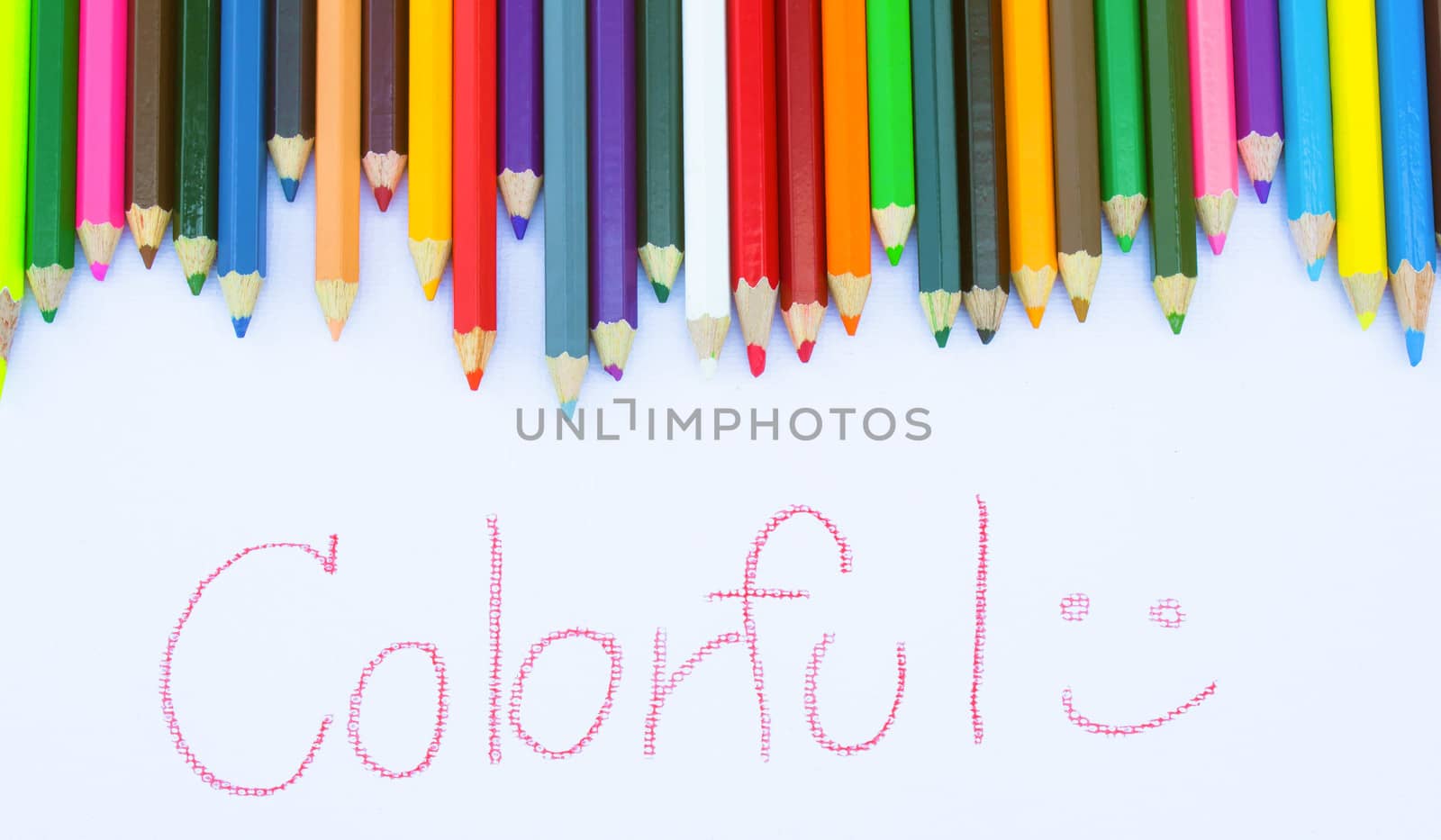 Background from color pencils with hand writing Colorful on white paper. Education frame concept.