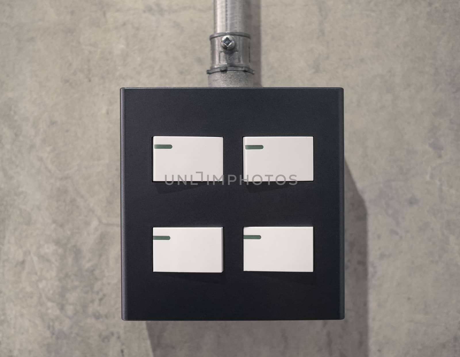 White light switch, turn on or turn off the lights on concrete wall in room. by TEERASAK