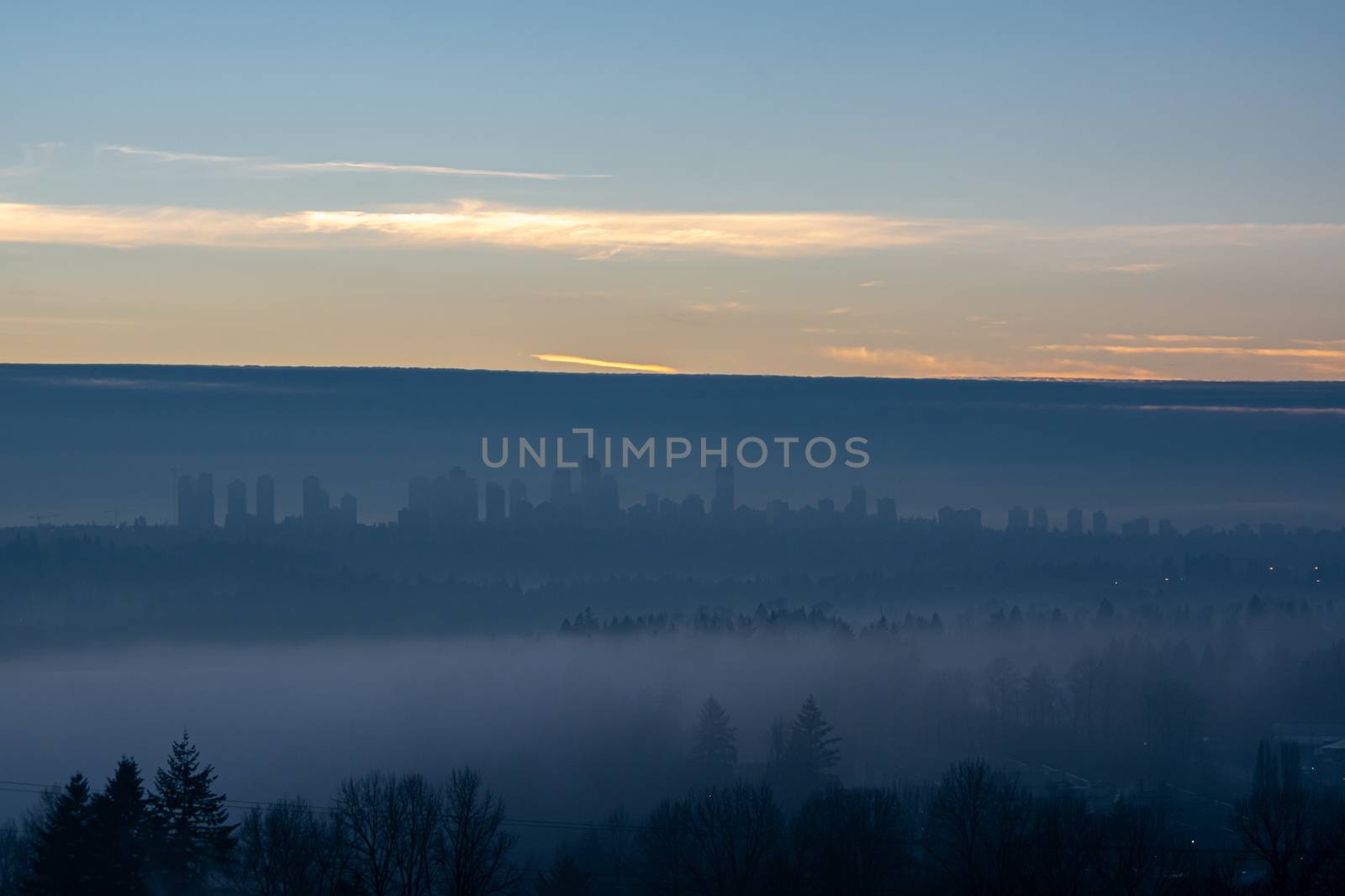 Clear sky above Metrotown covered with thick fog by Imagenet
