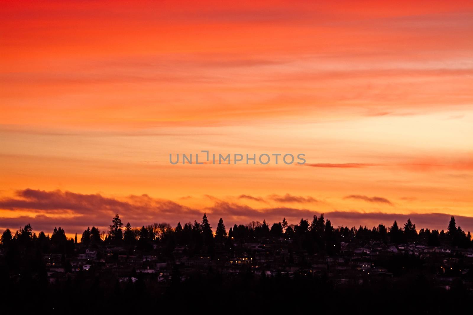 Suburban residential area on sunset sky background by Imagenet