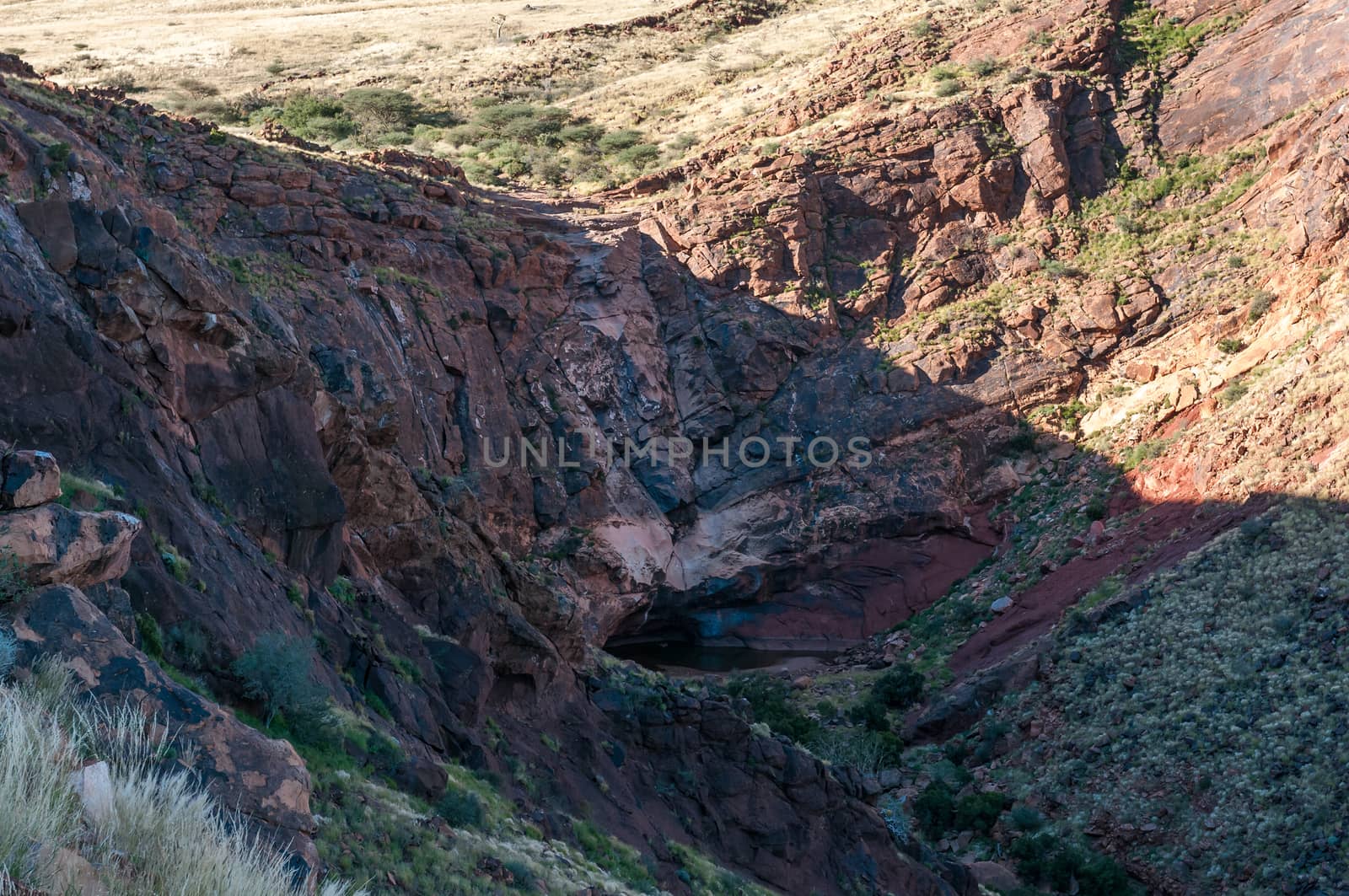 A dry waterfall is visible in a breach in the wall of Brukkaros mountain, an extinct volcano