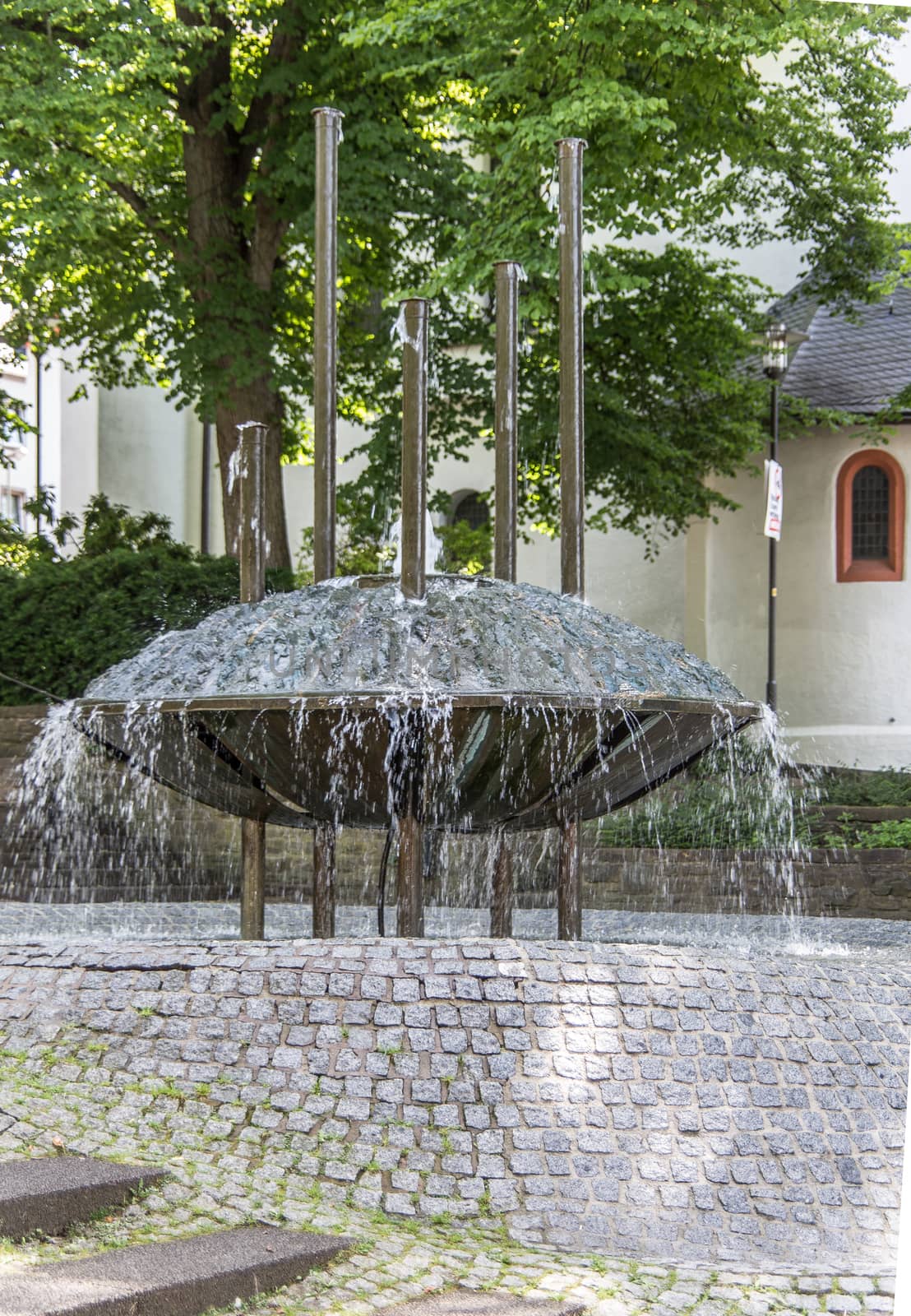 colorful fountain in front of church