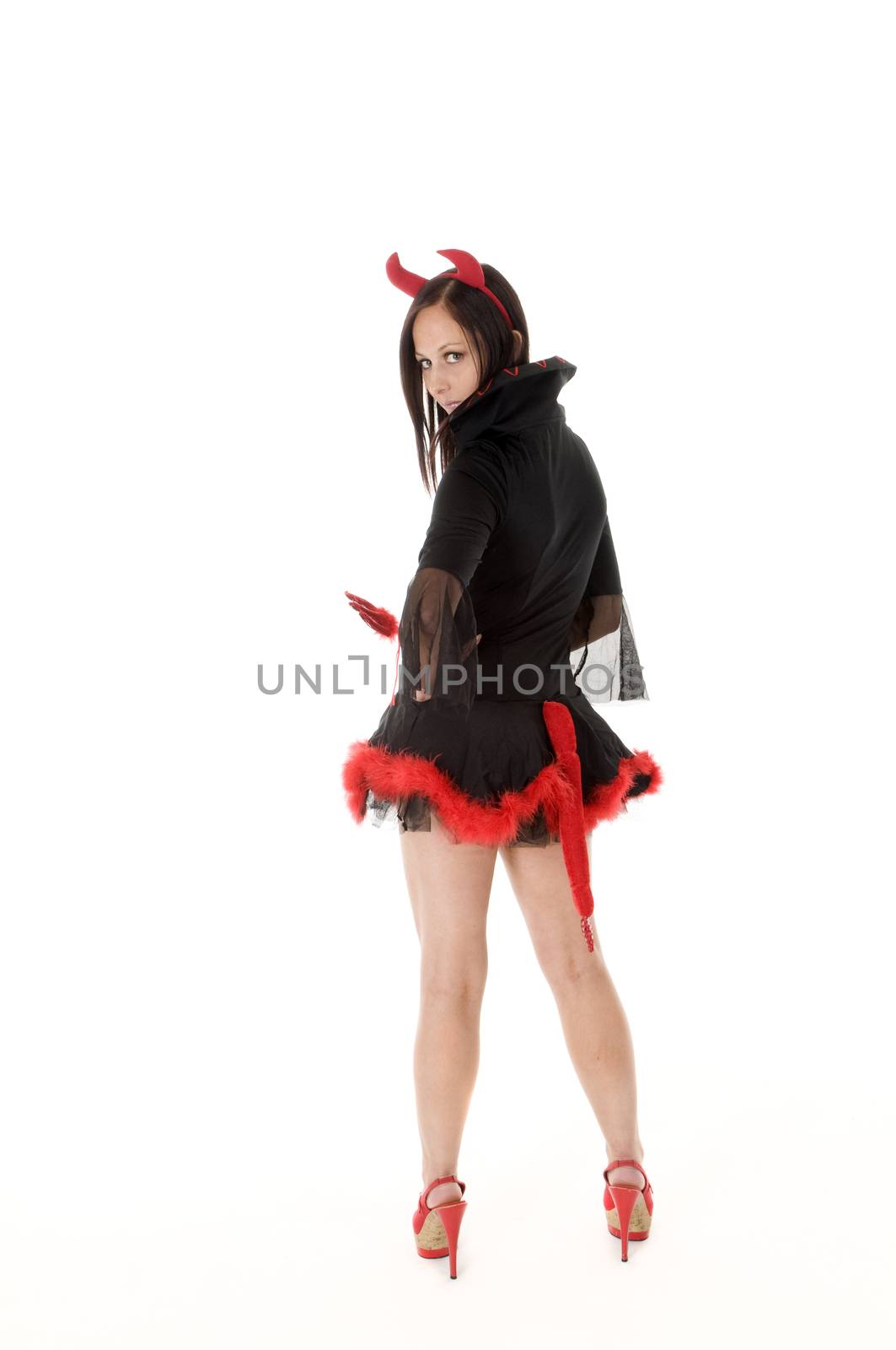 A Sexy woman in Halloween Devil costume rear view