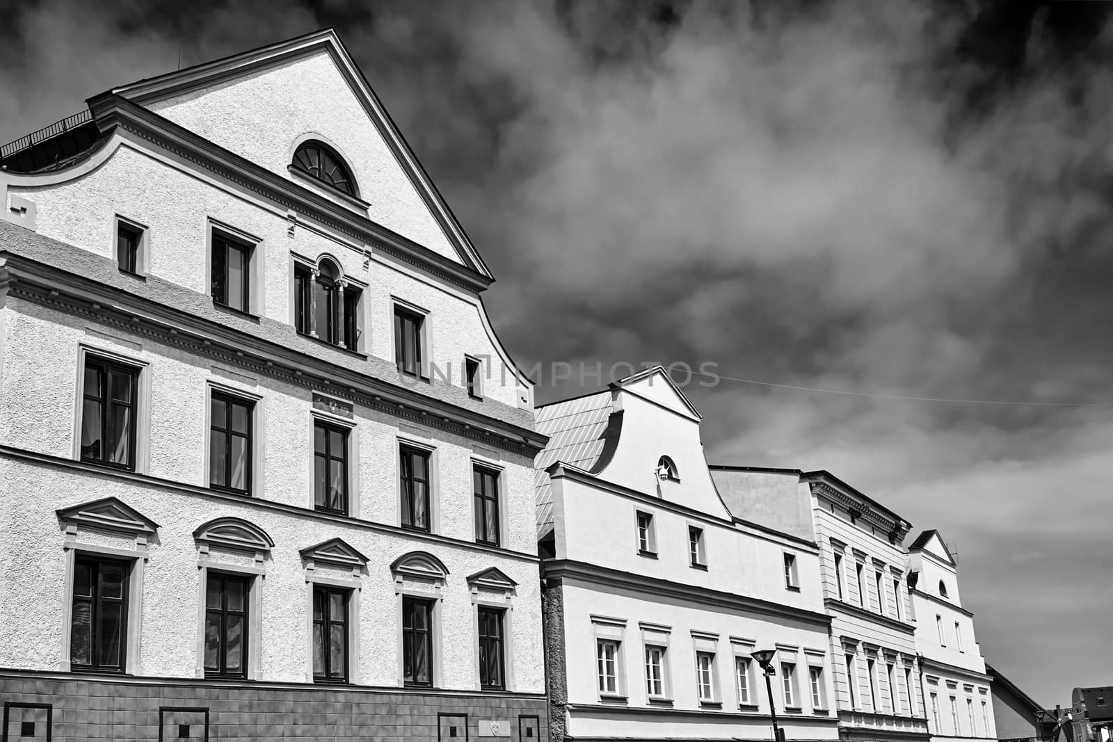 A historic tenement houses in the city of Javornik in the Czech Republic, black and white
