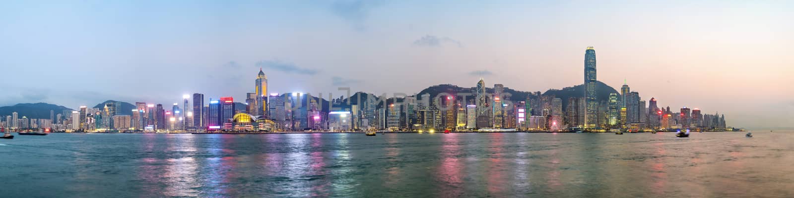 Panorama view of Hong Kong skyline on the evening seen from Kowloon. by Tanarch