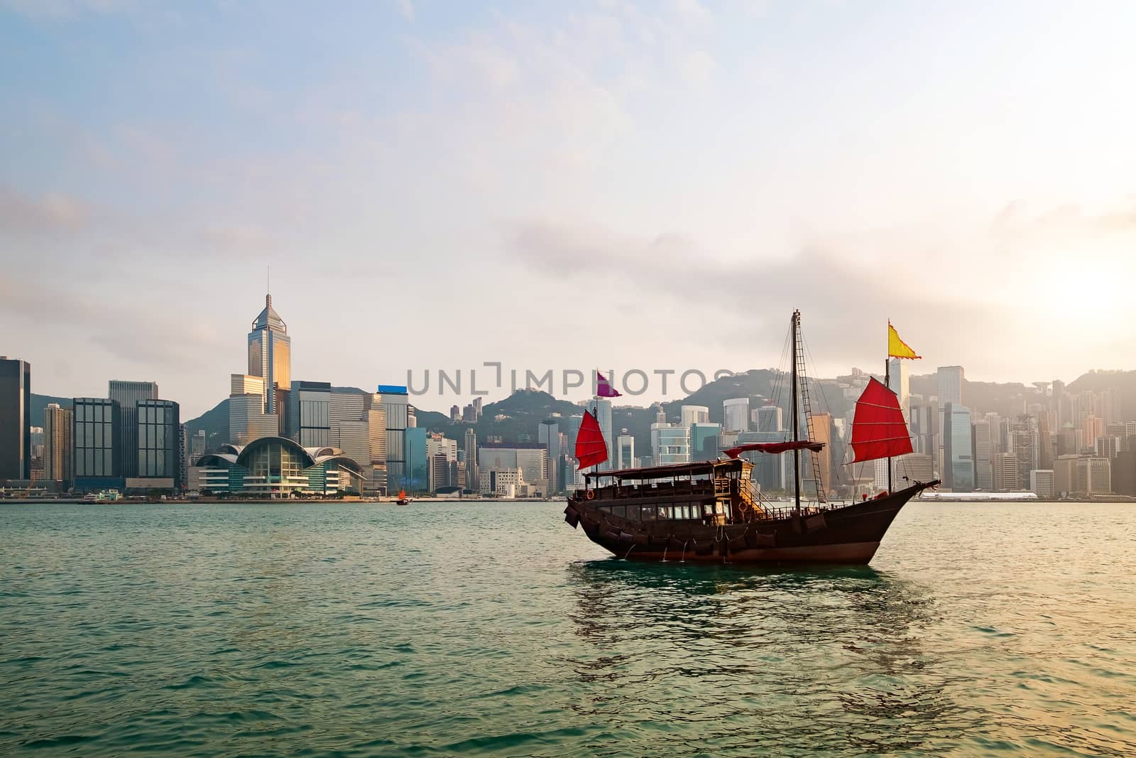 Hong Kong skyline with a traditional boat seen from Kowloon, Hong Kong, China.