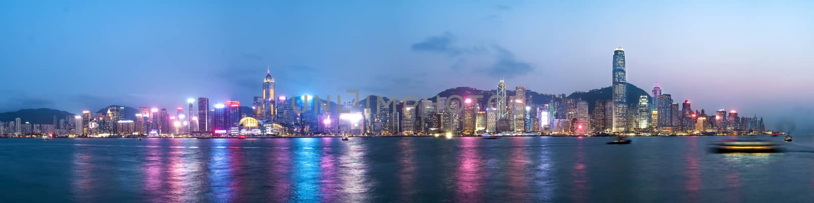 Panorama view of Hong Kong skyline on the evening seen from Kowloon, Hong Kong, China.