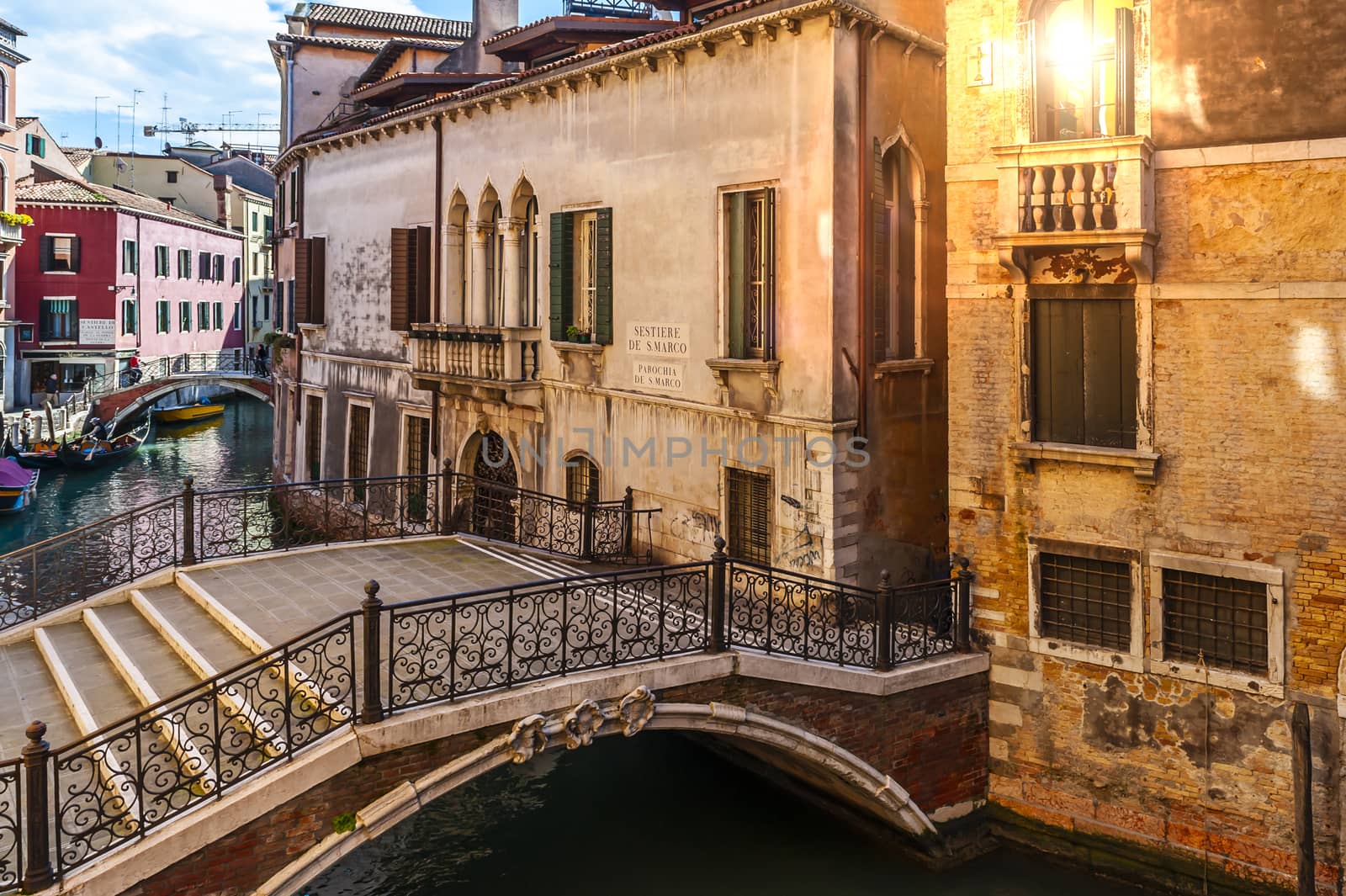 A canal running through the San Marco district and its bridges in Venice in Veneto.