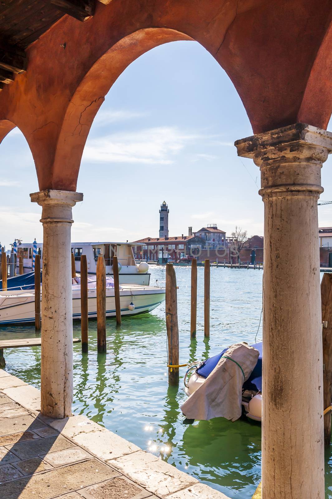 Murano lighthouse from the arcades of Fondamenta Navagero Andrea in Murano in Venice in Veneto, Italy by Frederic