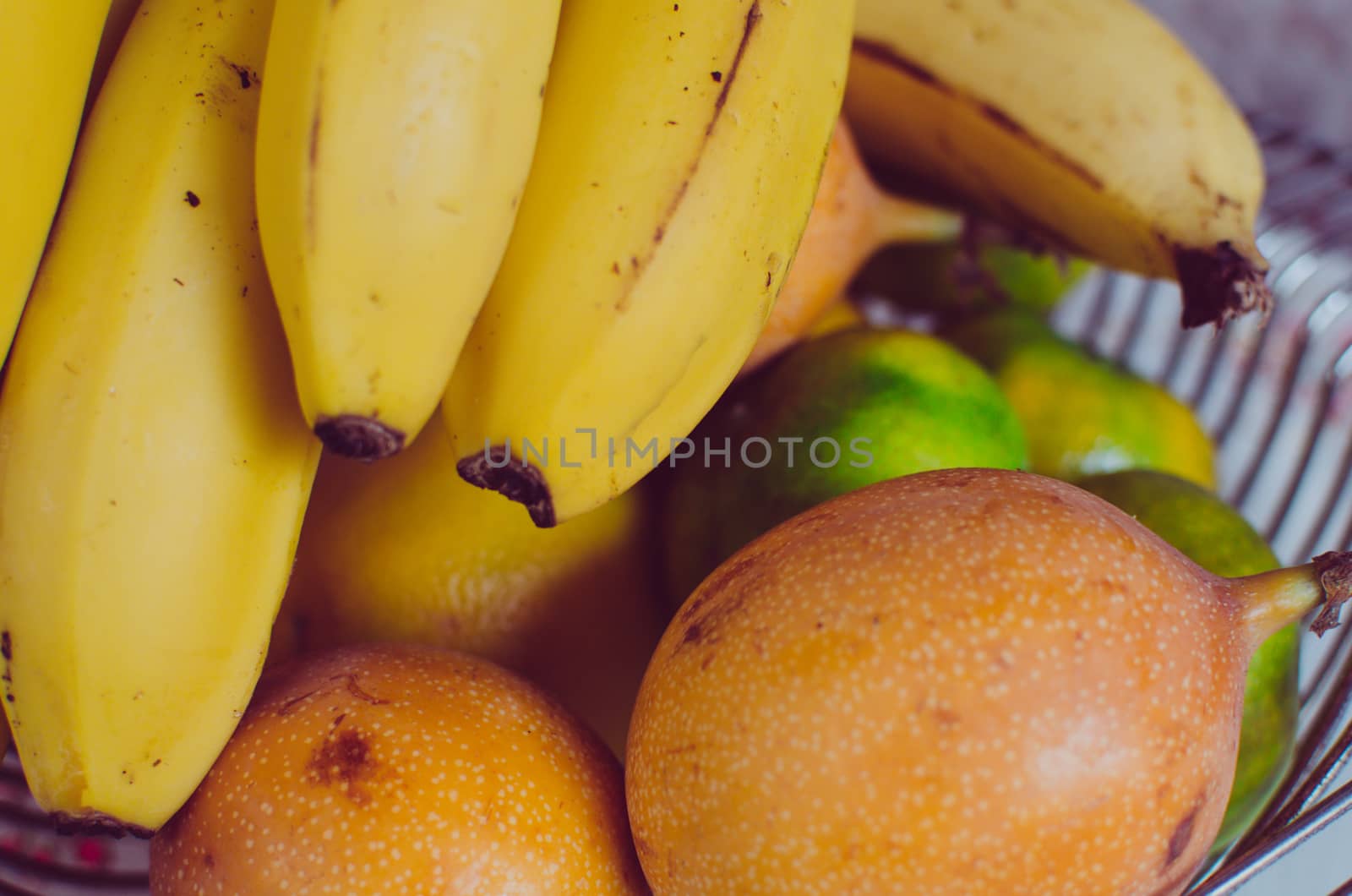 Fruits like banana, tangerine, pomegranate