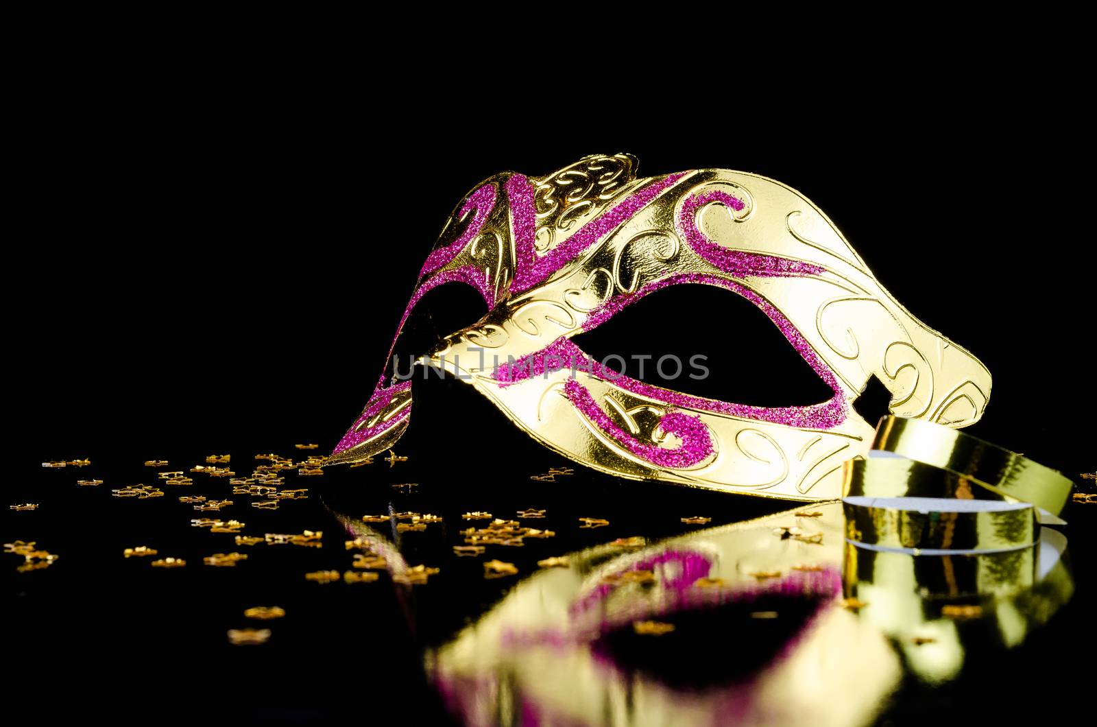 Carnival mask on black background with copy space for text