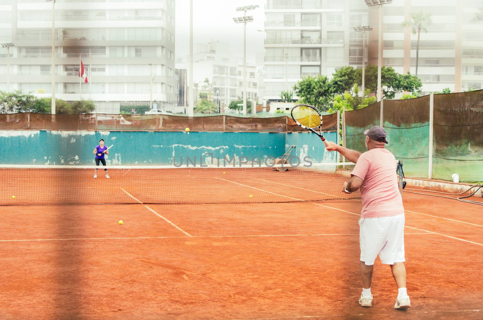 Tennis players with racket in full play