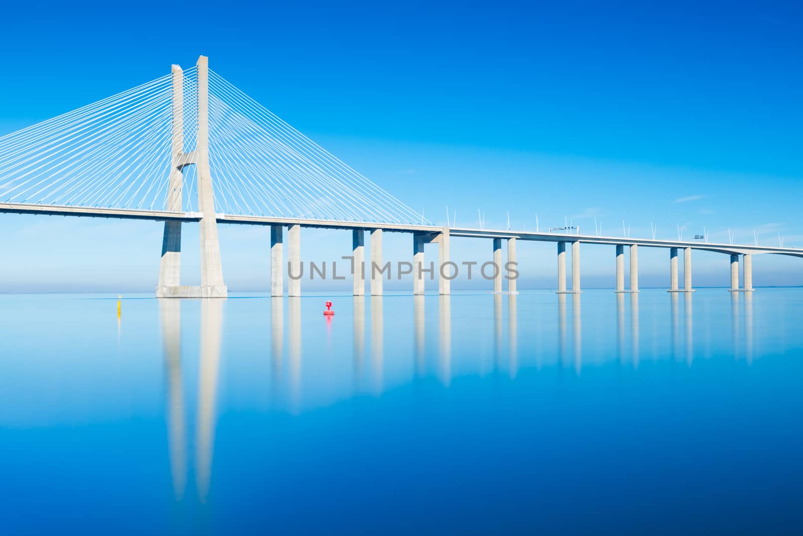 Vasco da Gama Bridge mirrored in The Tejo River, Lisbon, Portugal