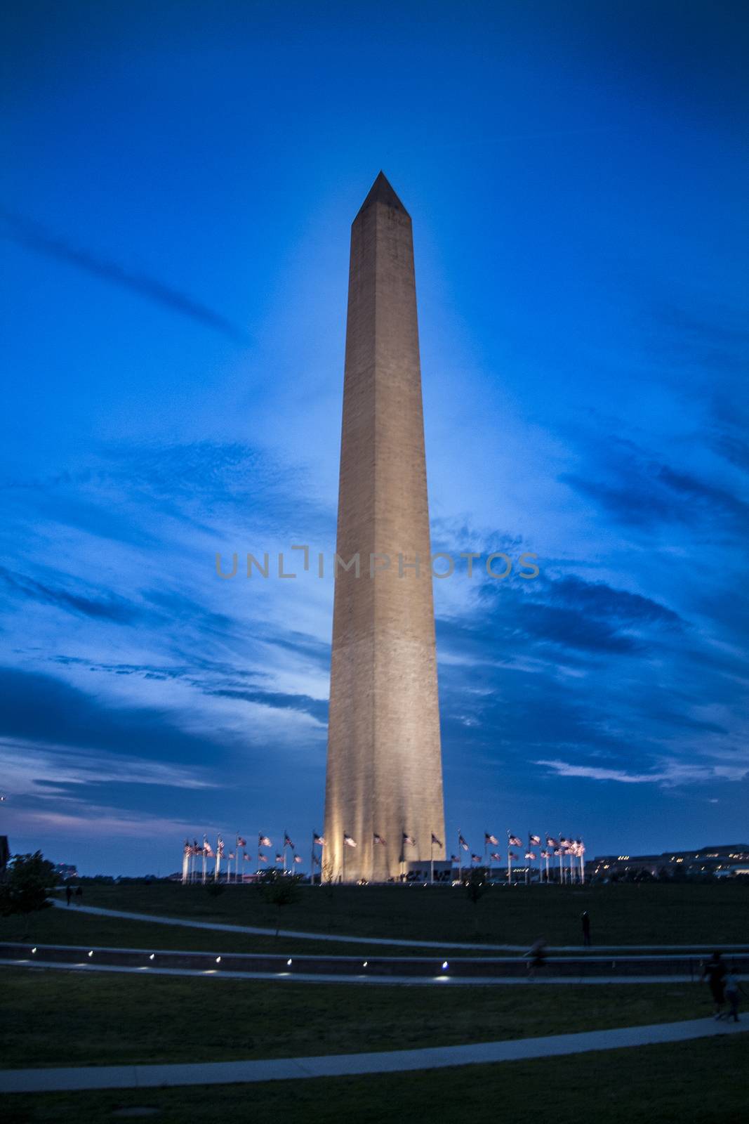 Washington Monument and circle of flags in the blue hour by tanaonte