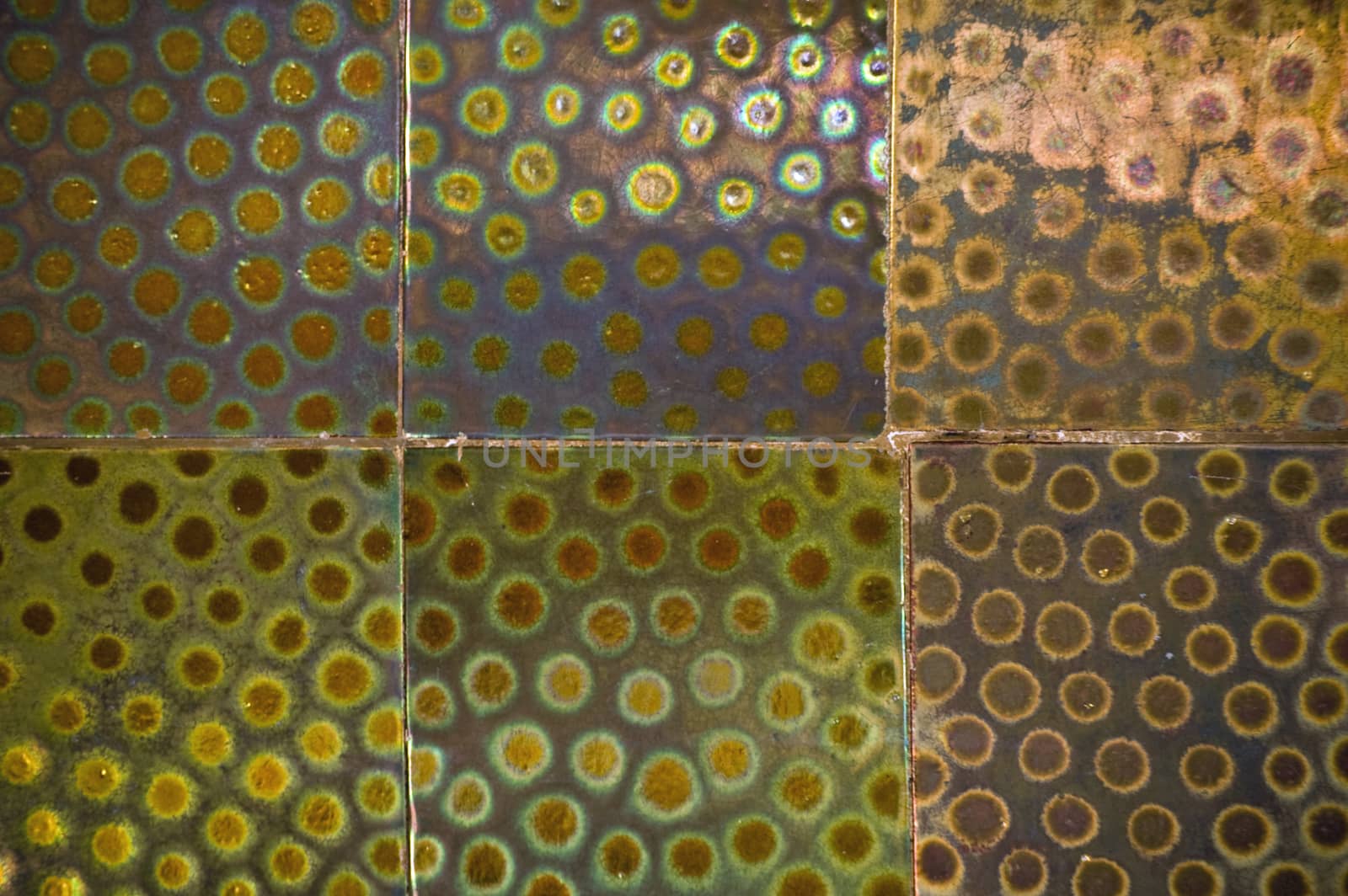 Close up of metallic glazed tiles dating from the art nouveau period and adorning the outside wall of the Hungarian Pavilion in the Giardini, Venice.