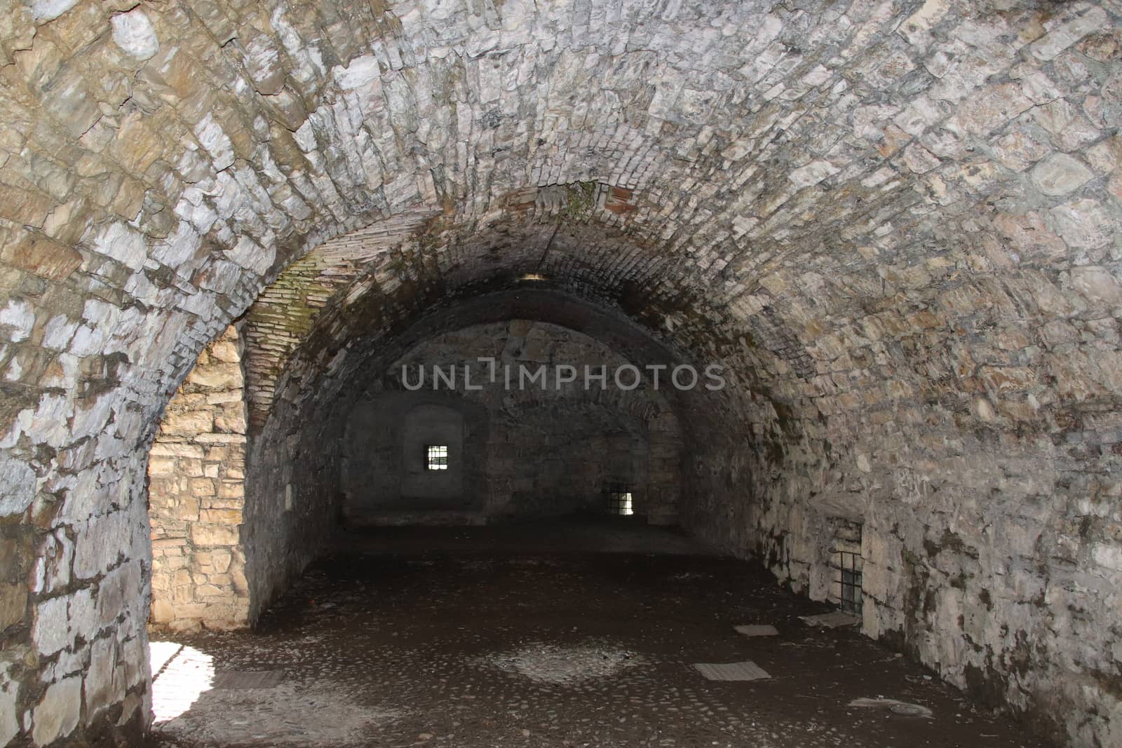 ancient dark secret passage of a castle in Italy