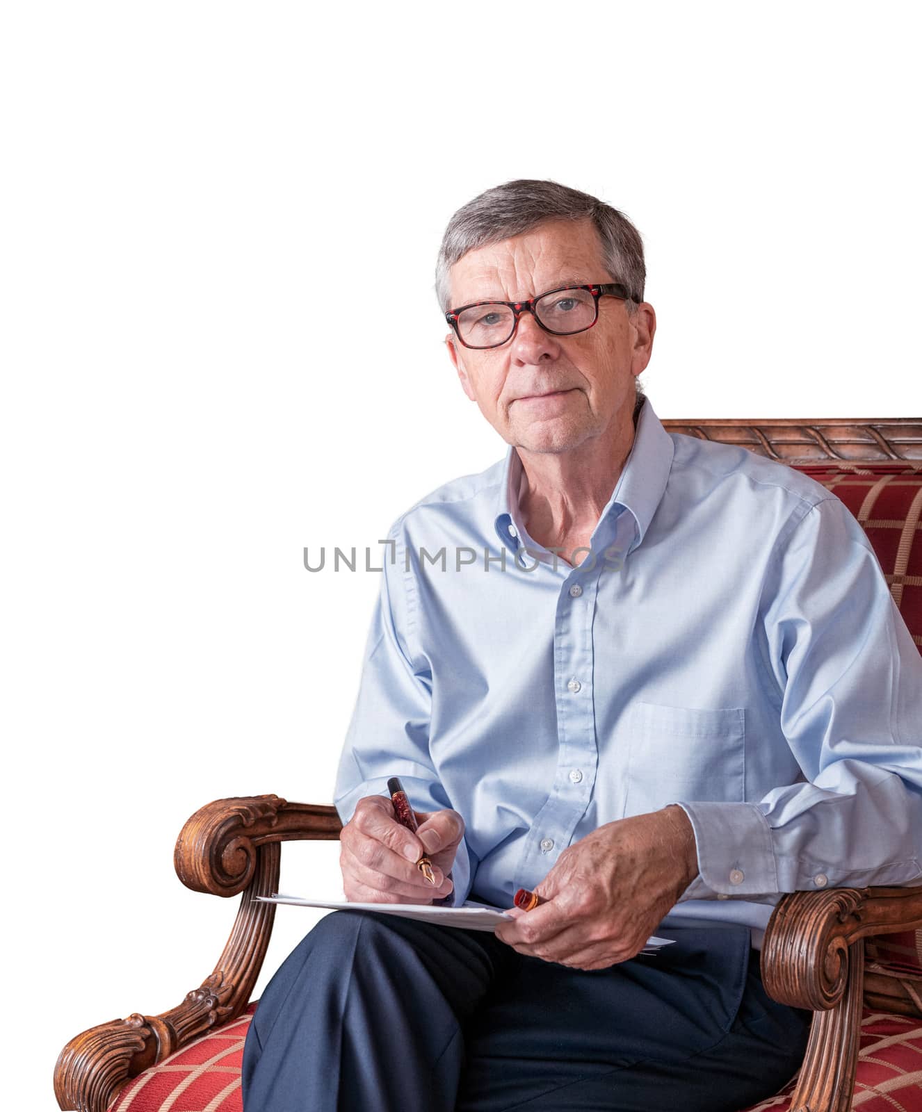 Senior man with spectacles checking a document and isolated against white by steheap