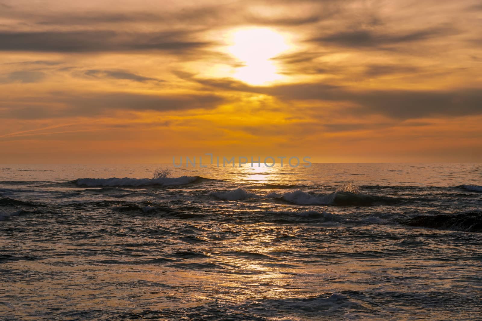 Beautiful colorful sunset over the sea, clouded sky on twilight time and reflection on the sea. in La Jolla, San Diego, California, USA