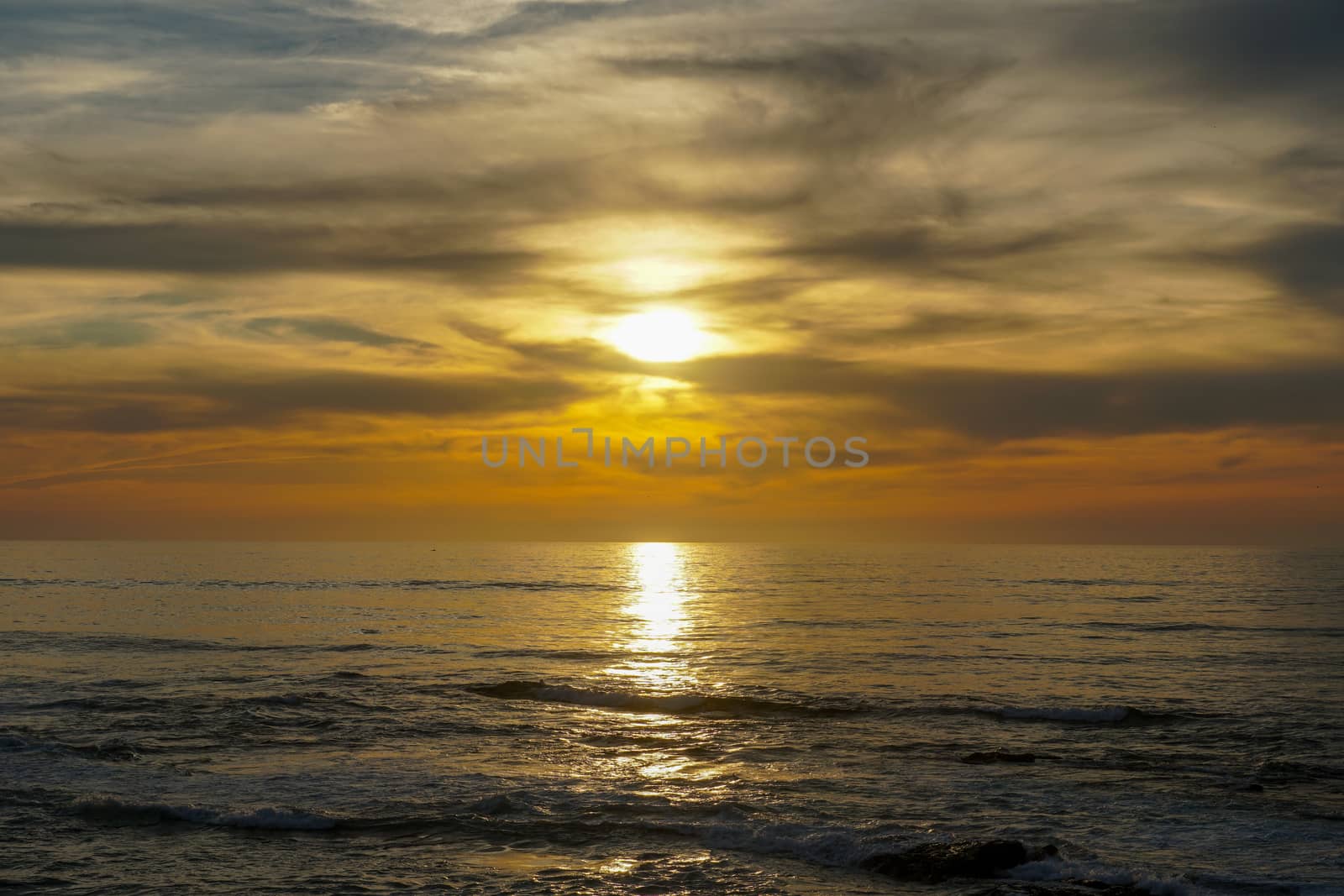 Beautiful colorful sunset over the sea, clouded sky on twilight time and reflection on the sea. in La Jolla, San Diego, California, USA