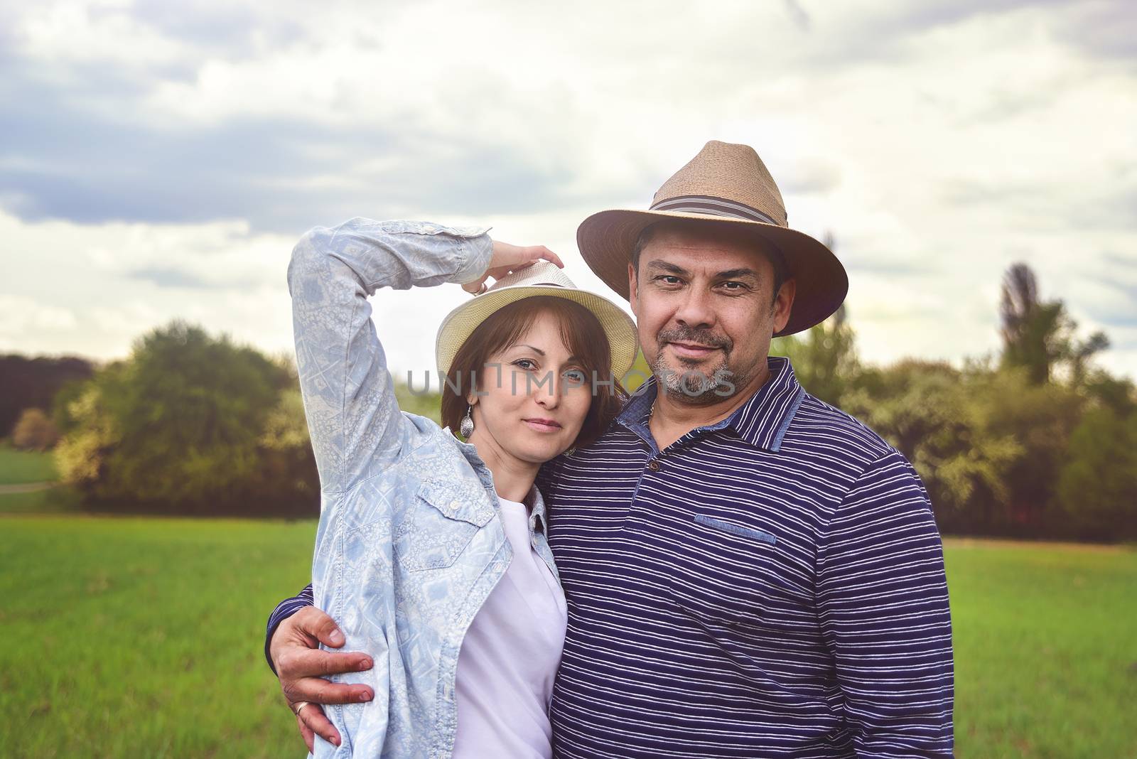 photo portrait of a happy middle-aged couple in nature, love concept