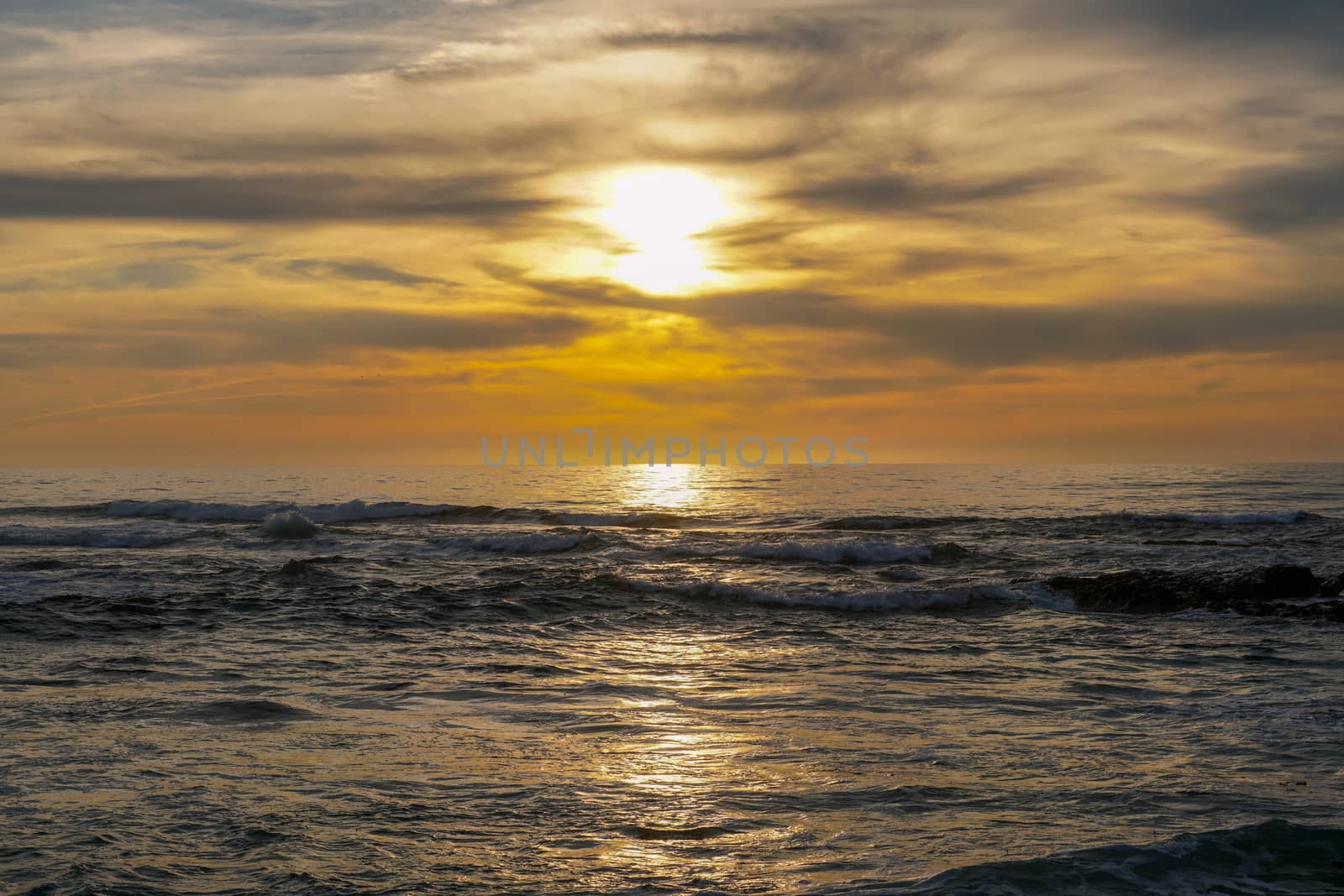 Beautiful colorful sunset over the sea, clouded sky on twilight time and reflection on the sea. in La Jolla, San Diego, California, USA