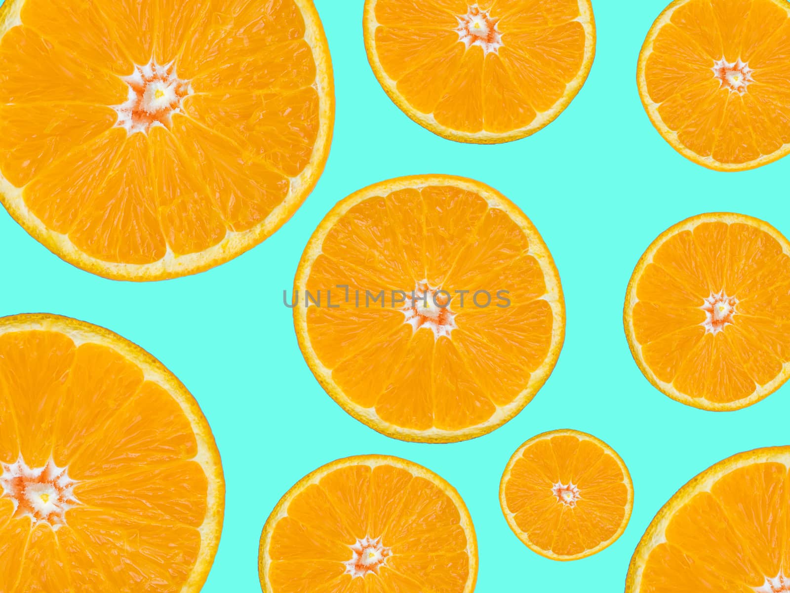 orange slice for food and beverage background. orange slices textured surface pattern on green background, pop art style.