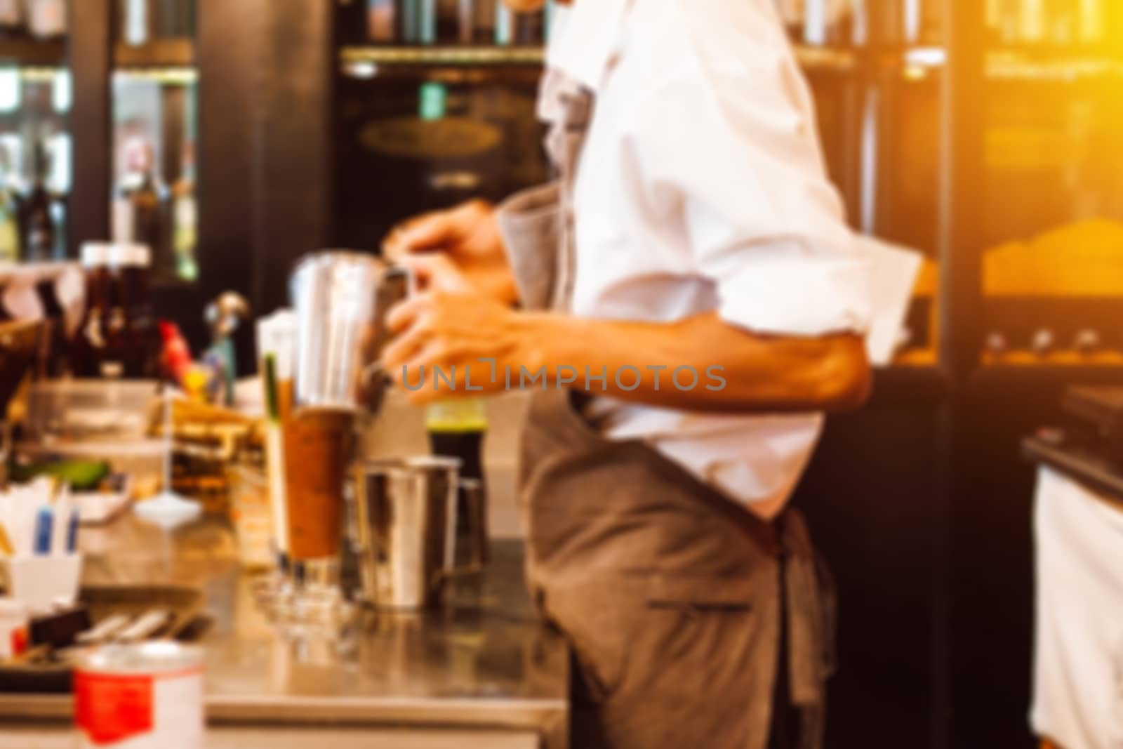 Abstract blur background of barista for coffee shop business background. Barista cafe coffee grinder pour professional concept.