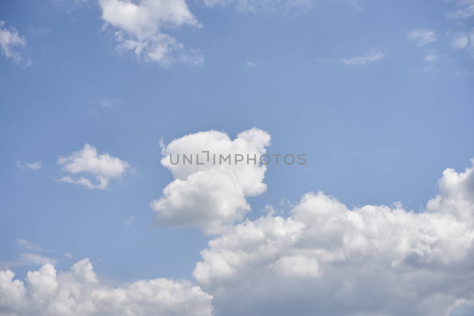 Blue sky with white fluffy cloud summer sunny day by andreonegin