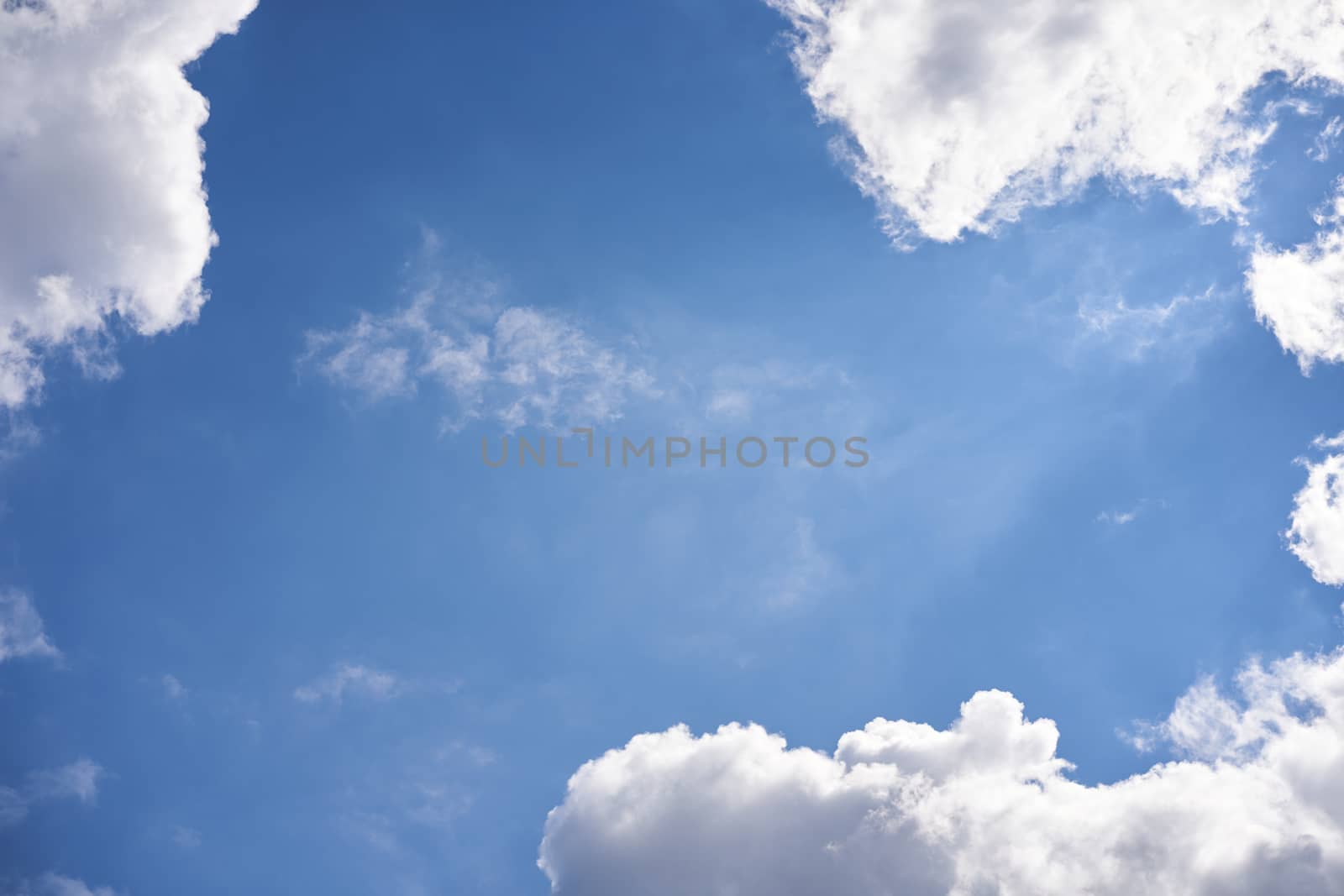 Blue sky with white fluffy cloud summer sunny day background