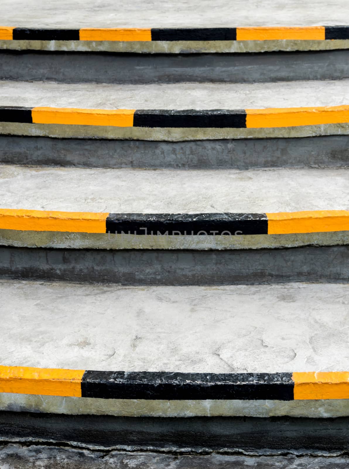 Yellow and black stripes, safety symbols at the edge of the stairs