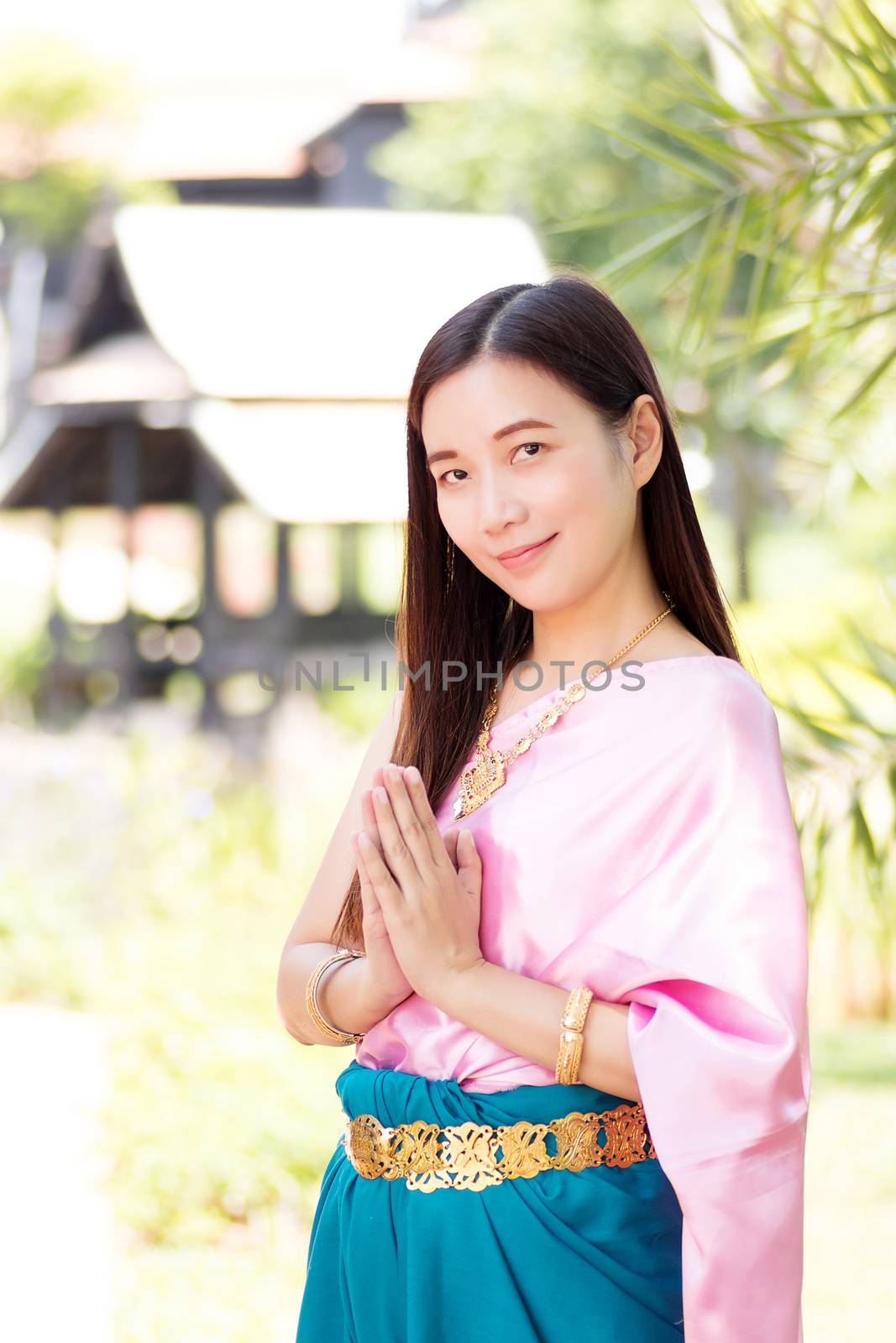 Asian beautiful woman wearing traditional Thai culture,vintage traditional dress suit style pay respect. Traditional Thai dress with identity Thai culture Sawasdee,Welcome expression Sawasdee by asiandelight