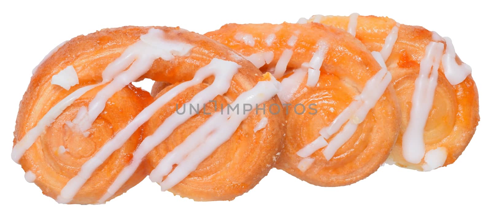 Pretzel shaped sugar cookies, made of puff pastry with butter on a white background. 