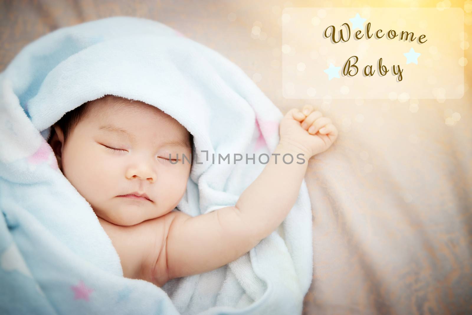 Colorful cute baby shower beautiful card with text welcome new baby in transparent frame, with the gold elements , star and wonderful bokeh in the morning light. film effect by asiandelight