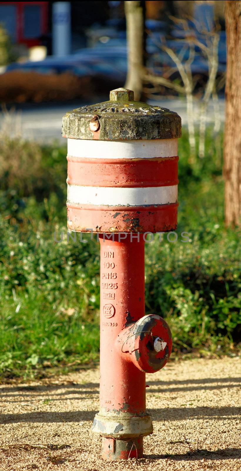 Fire-brigade hydrant with red and white stripes in Germany