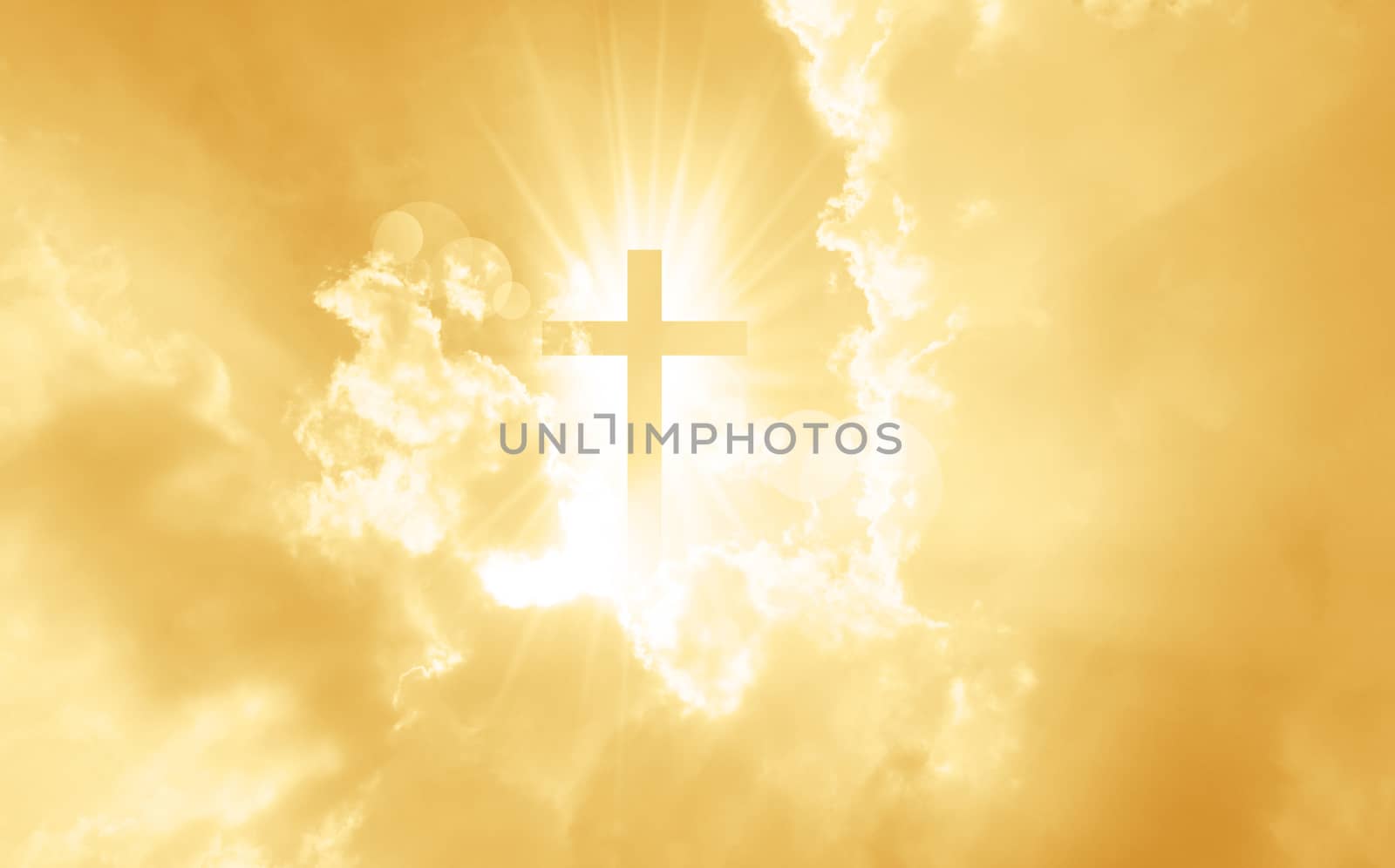 Christian cross appears bright in the yellow sky background