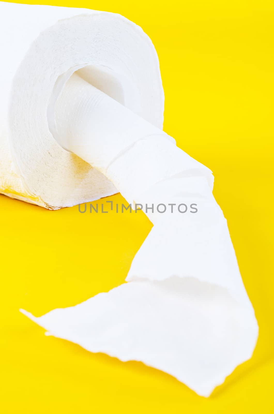 Tissue paper rolls on the yellow background.