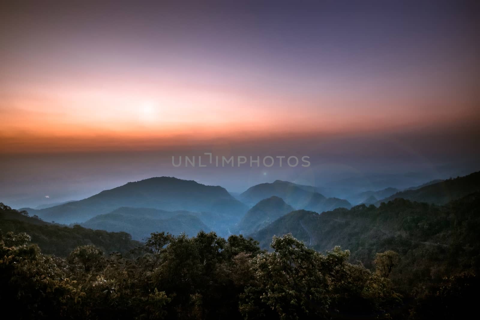 Beautiful sunrise in the morning on the top view point above the deep forest valley in national park with lens flare. sunrise background