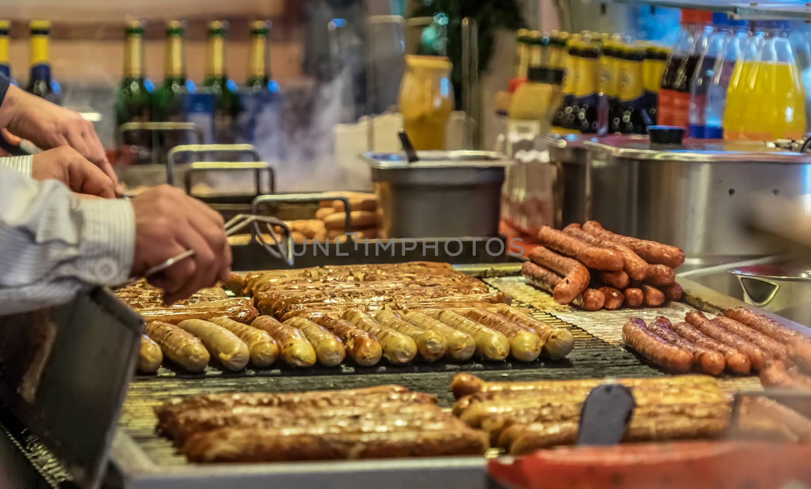 Bratwurst on the grill grid at a booth at the Christmas market in Braunschweig, Germany, detail view