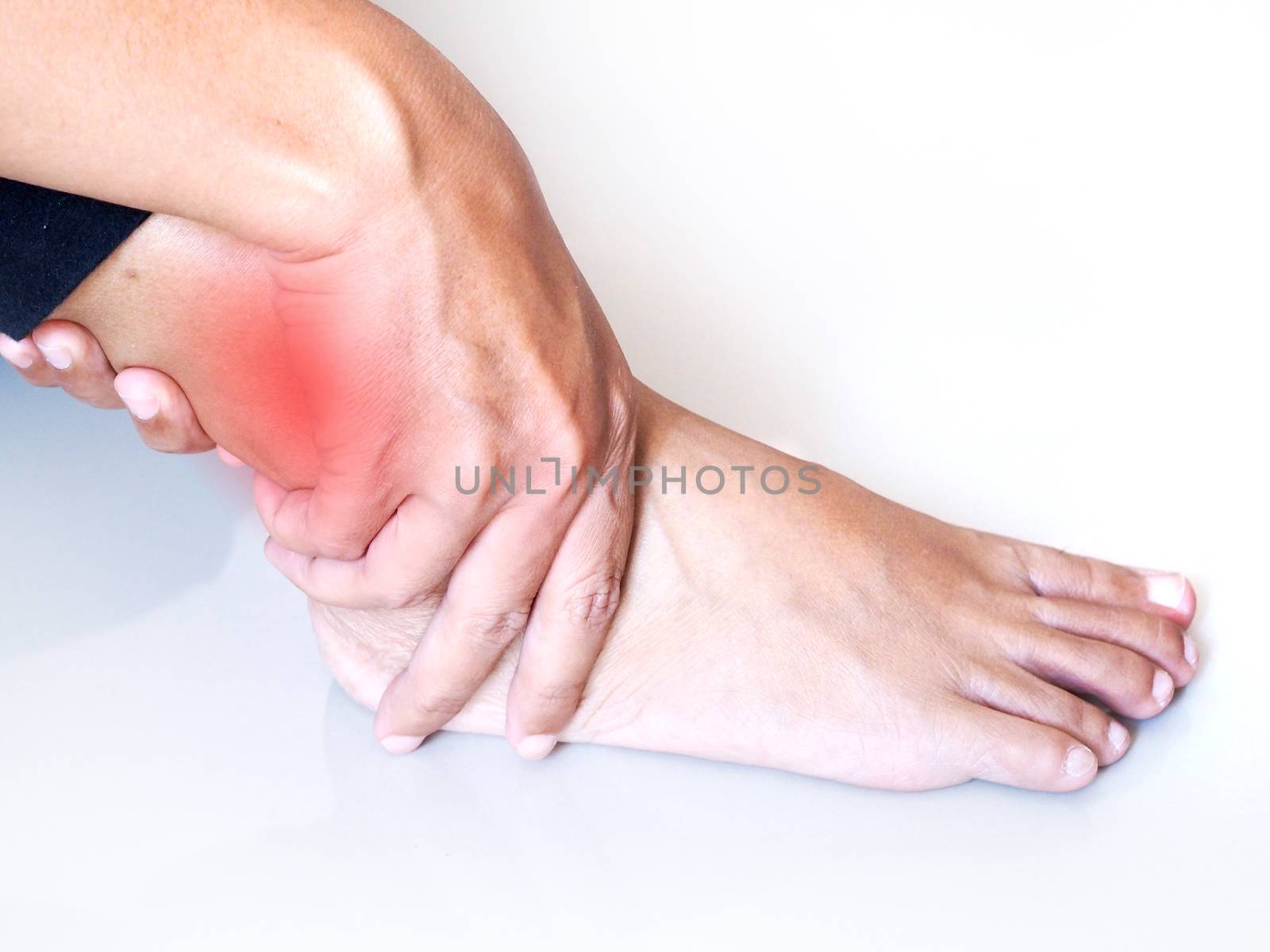 Young asian woman with ankle pain and acute leg injury. Medical health care concept.