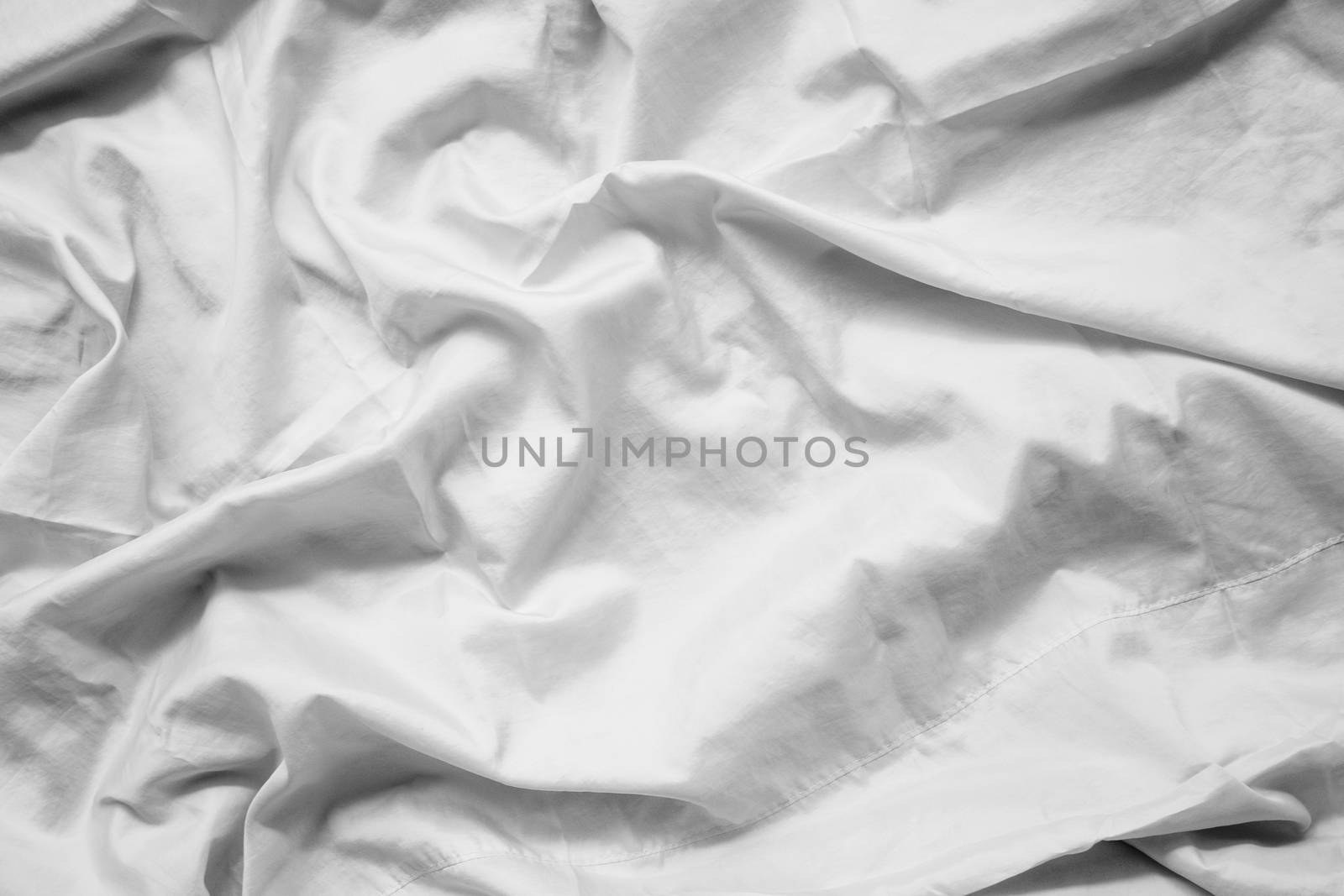White fabric abstract background concept. white wrinkled silk cloth wave texture satin material by asiandelight