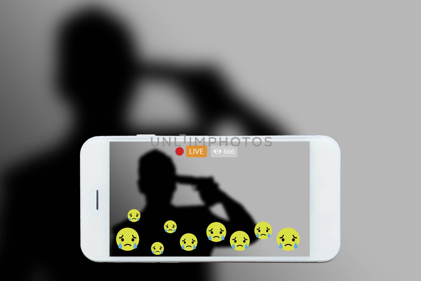 Problem of using social networks with wrong purpose effect concept:silhouette of man holding gun in hand stream his commits suicide stream live on social media. Crime ,violence within social networks.